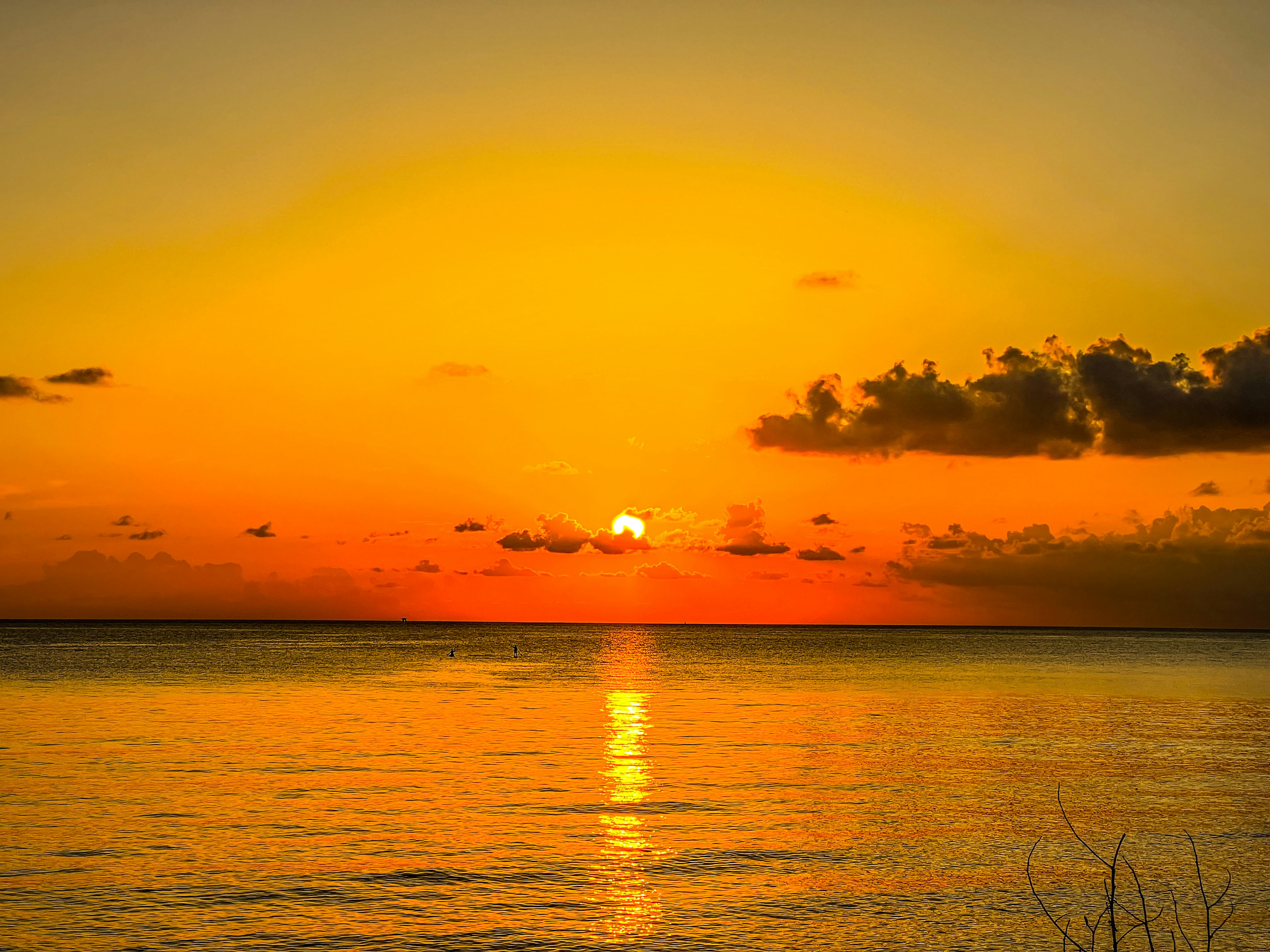 Beautiful sunset over the ocean with orange and yellow hues