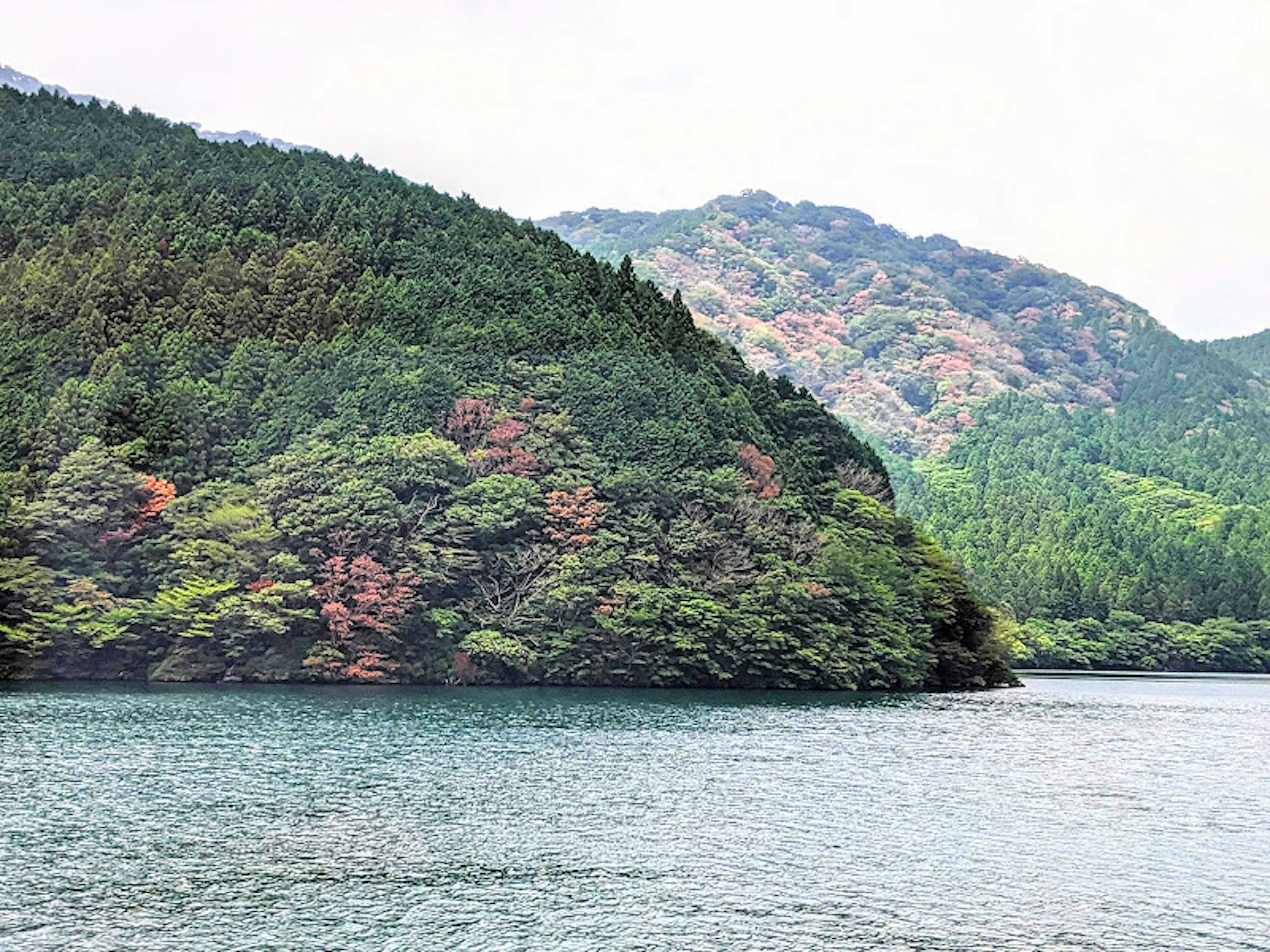 Lush green mountains and a serene lake landscape