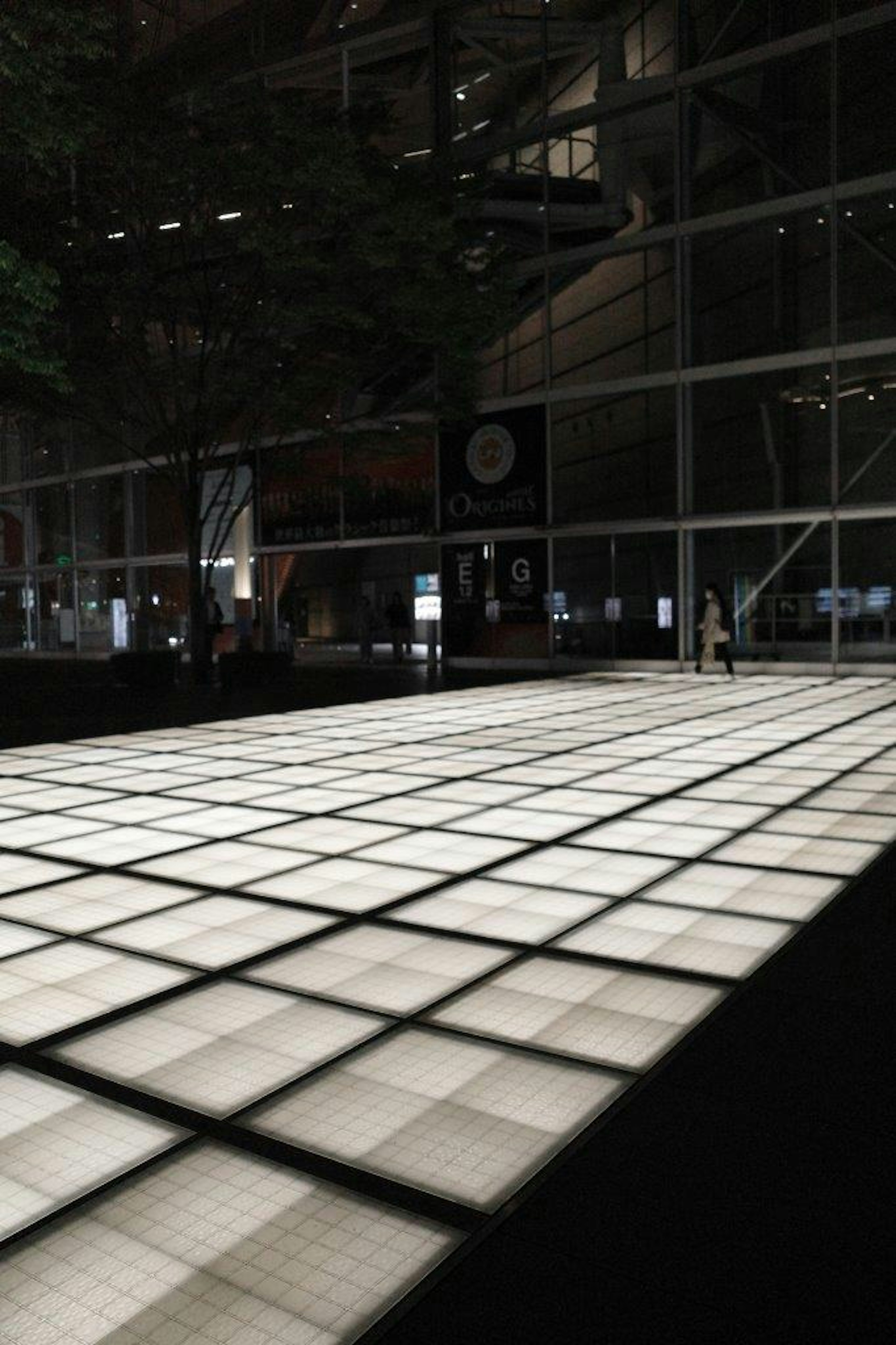 Bright square tiles arranged on the floor of a modern building interior