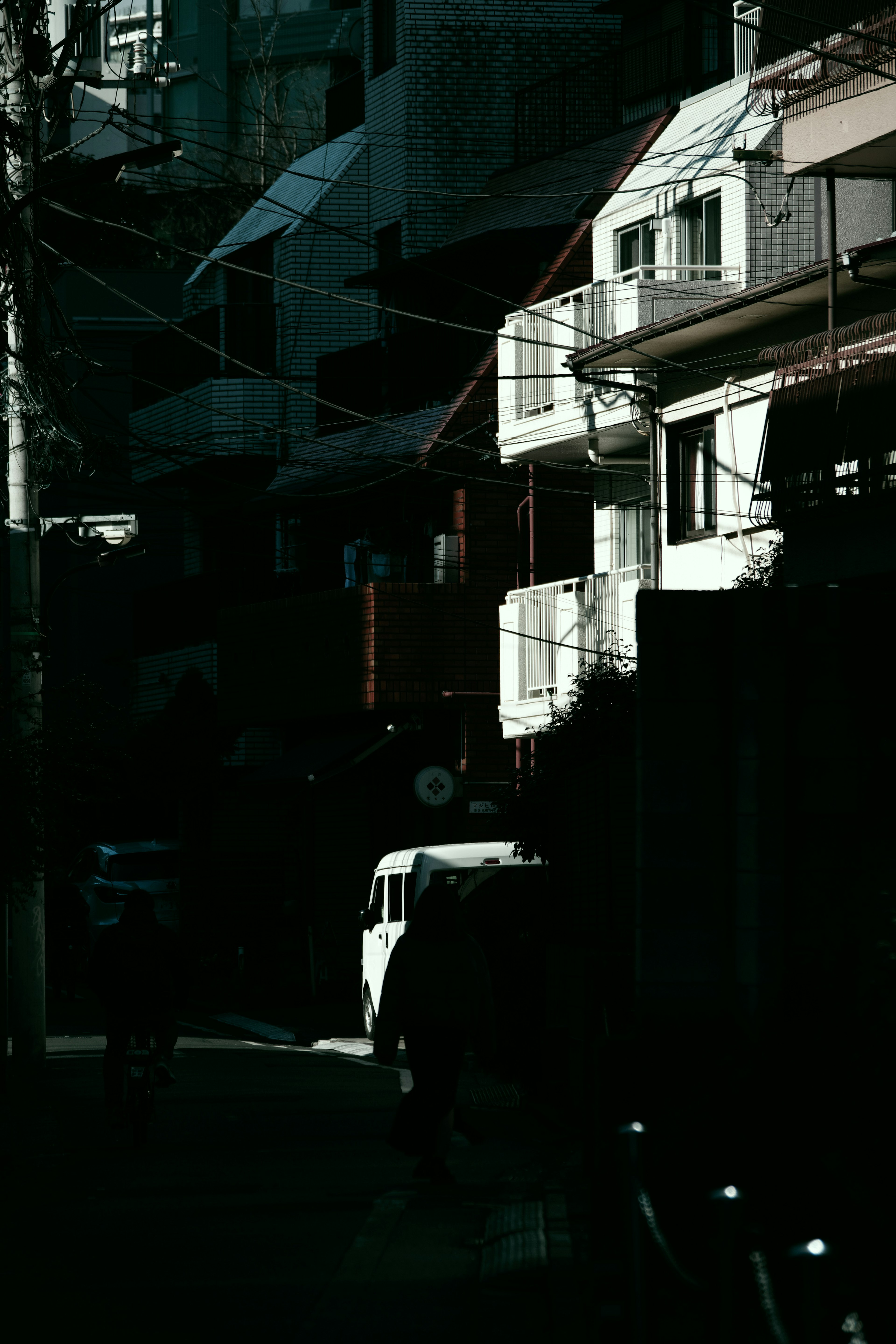 Urban street scene with buildings and a parked vehicle