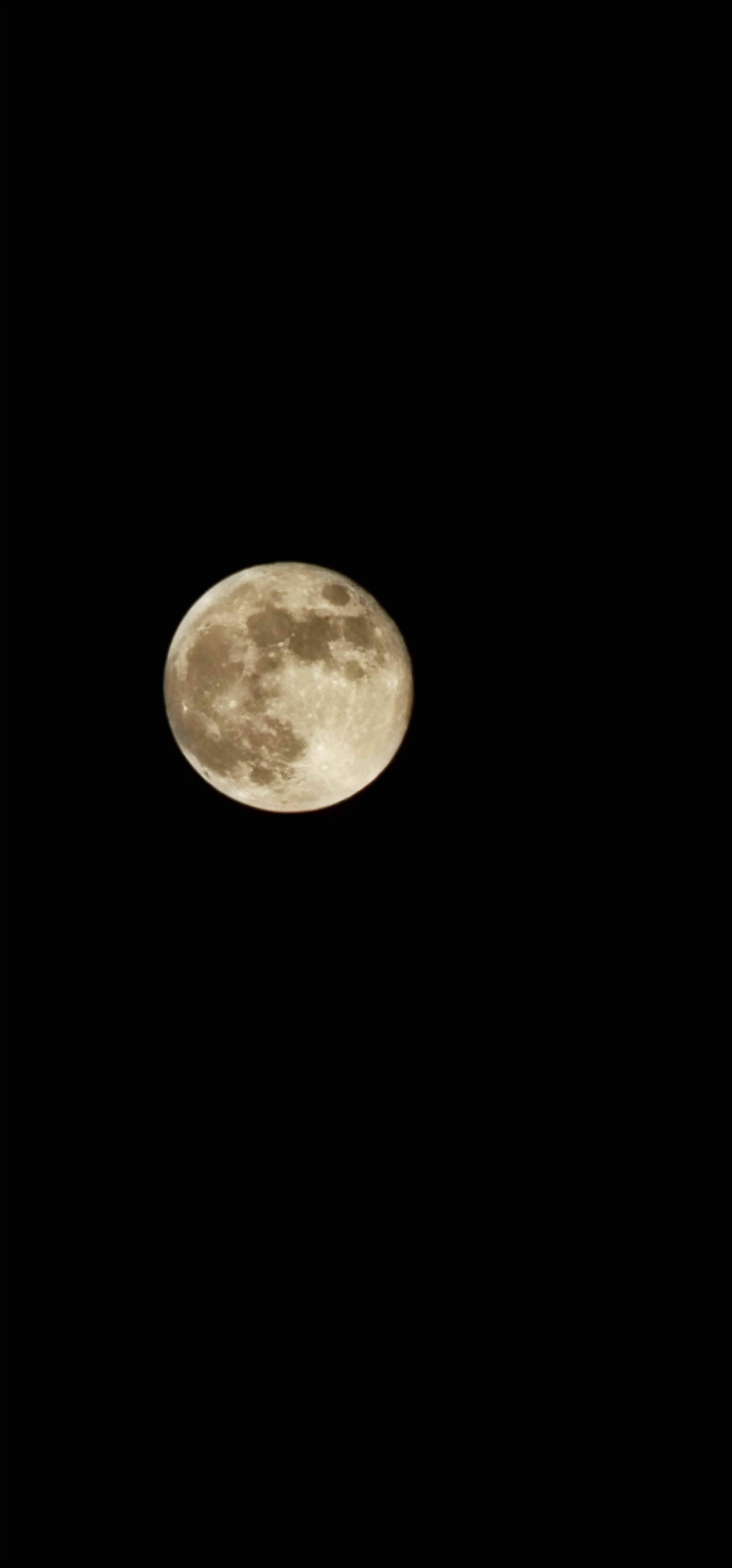 Bright full moon in the night sky