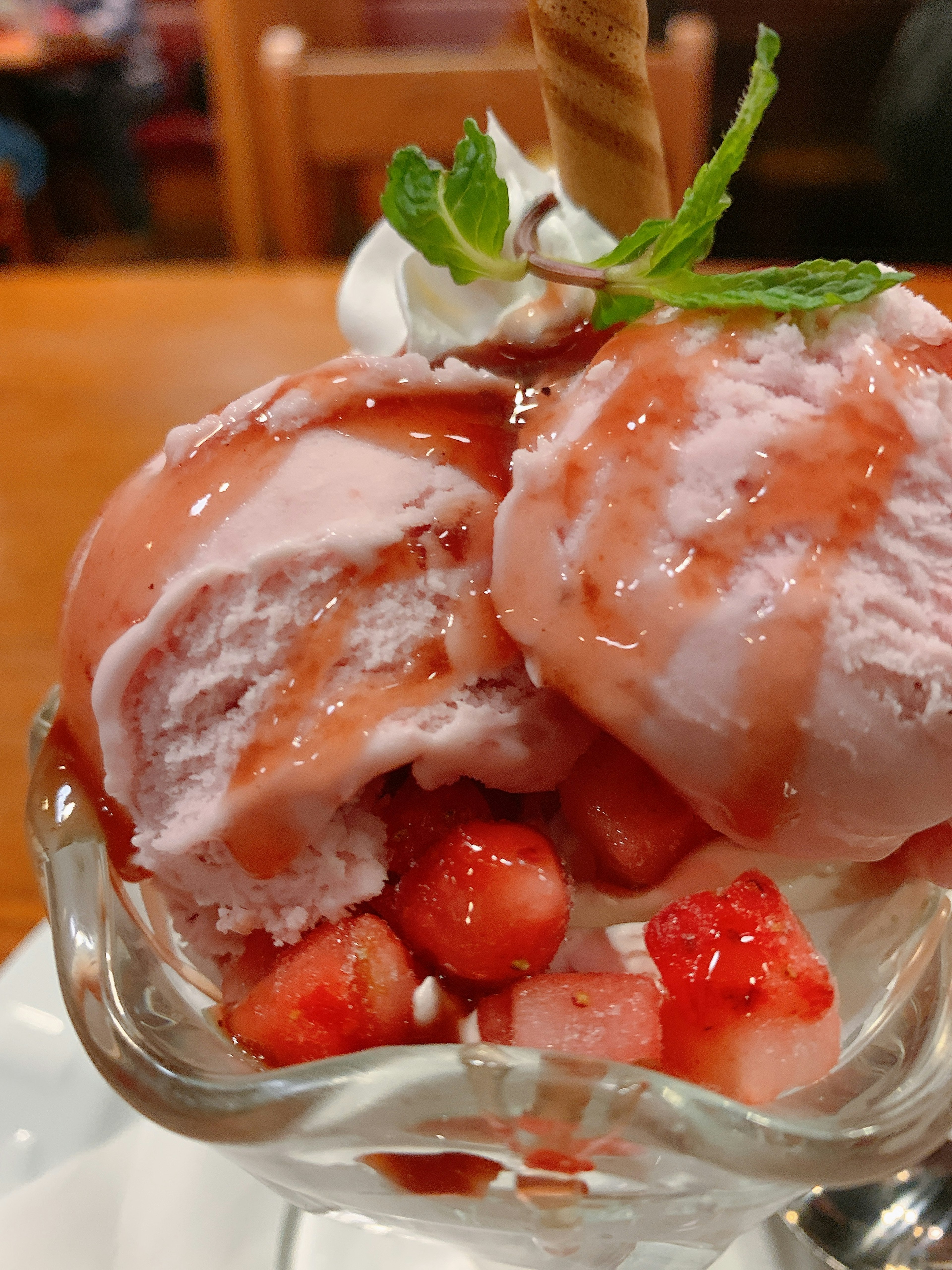 Strawberry ice cream dessert with fresh strawberries and whipped cream