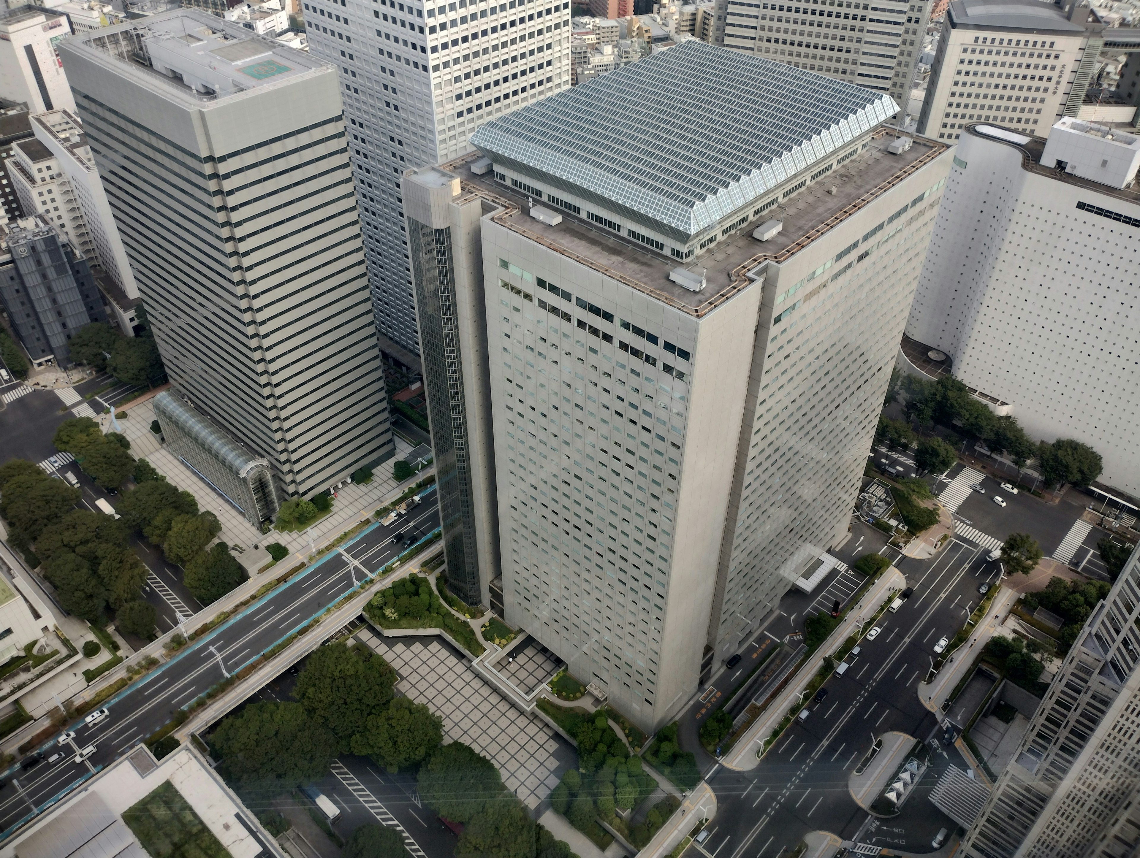 Aerial view of skyscrapers featuring modern buildings and traffic