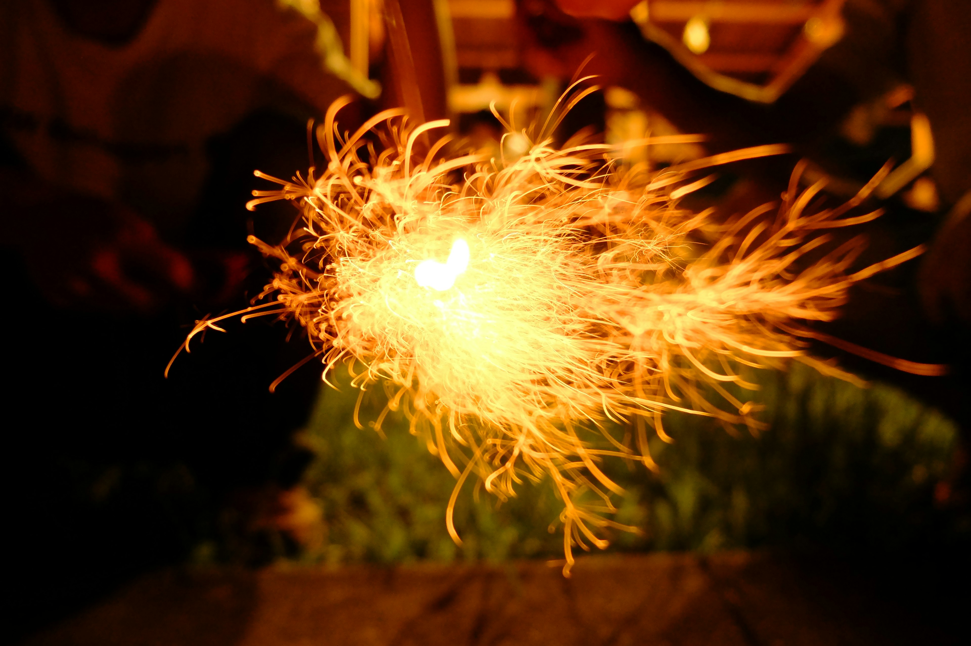 Sparkler glowing brightly at night