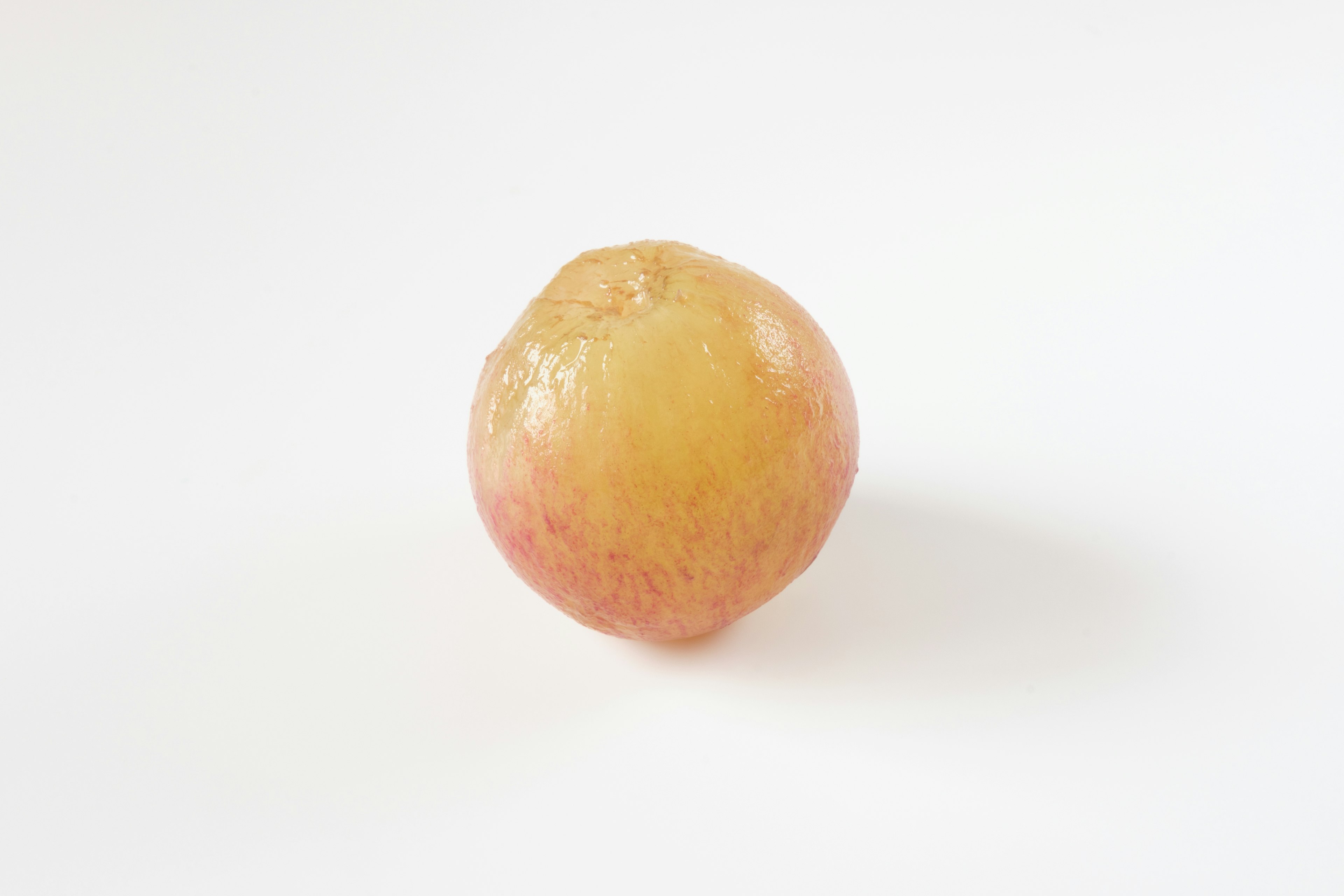 A yellow-green apple placed on a white background