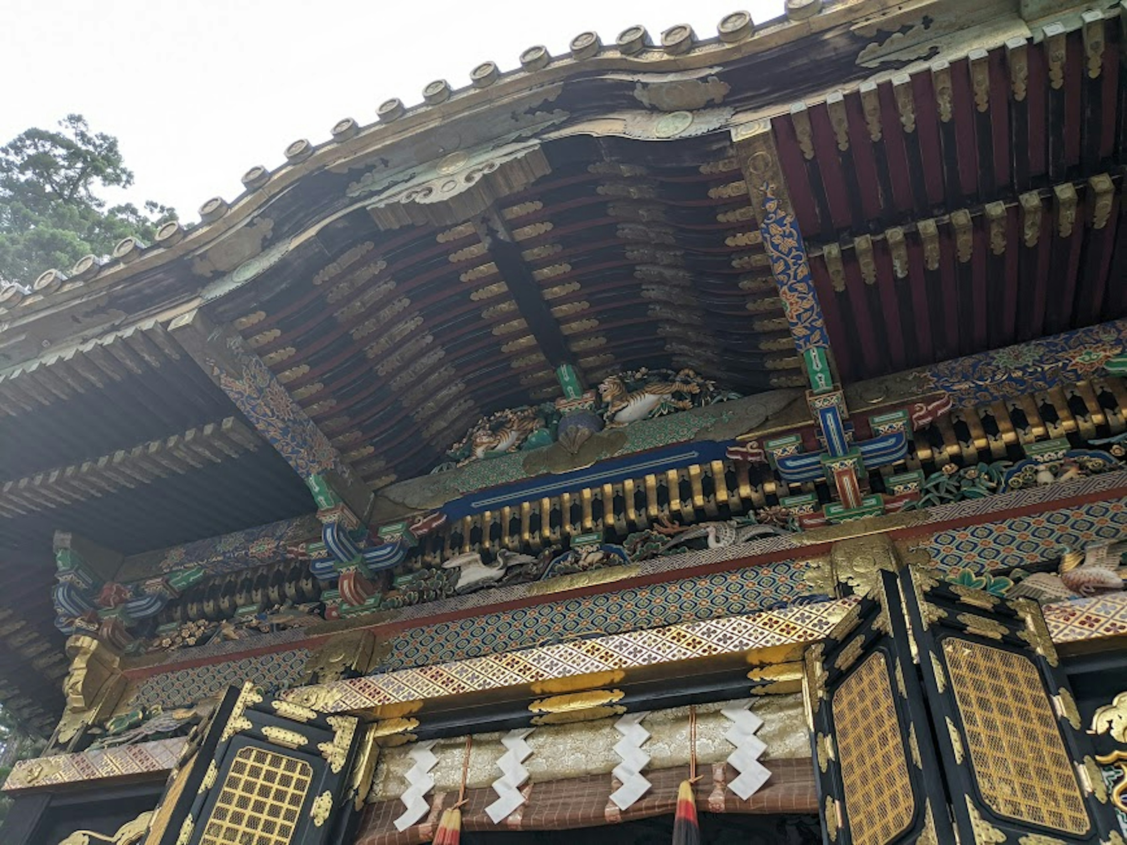 Traditional Japanese temple roof adorned with intricate decorations