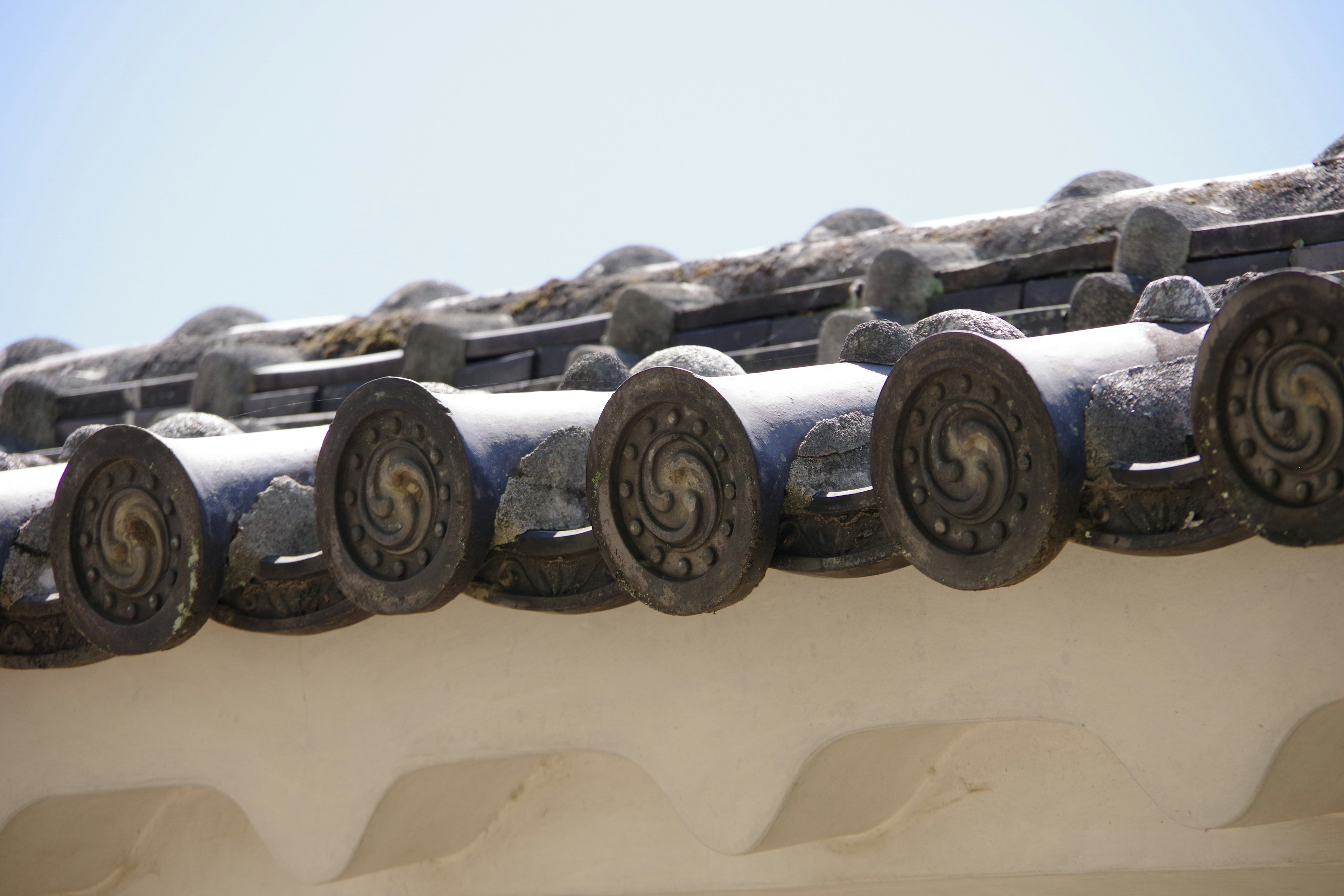 Close-up of traditional roof tiles showcasing intricate designs