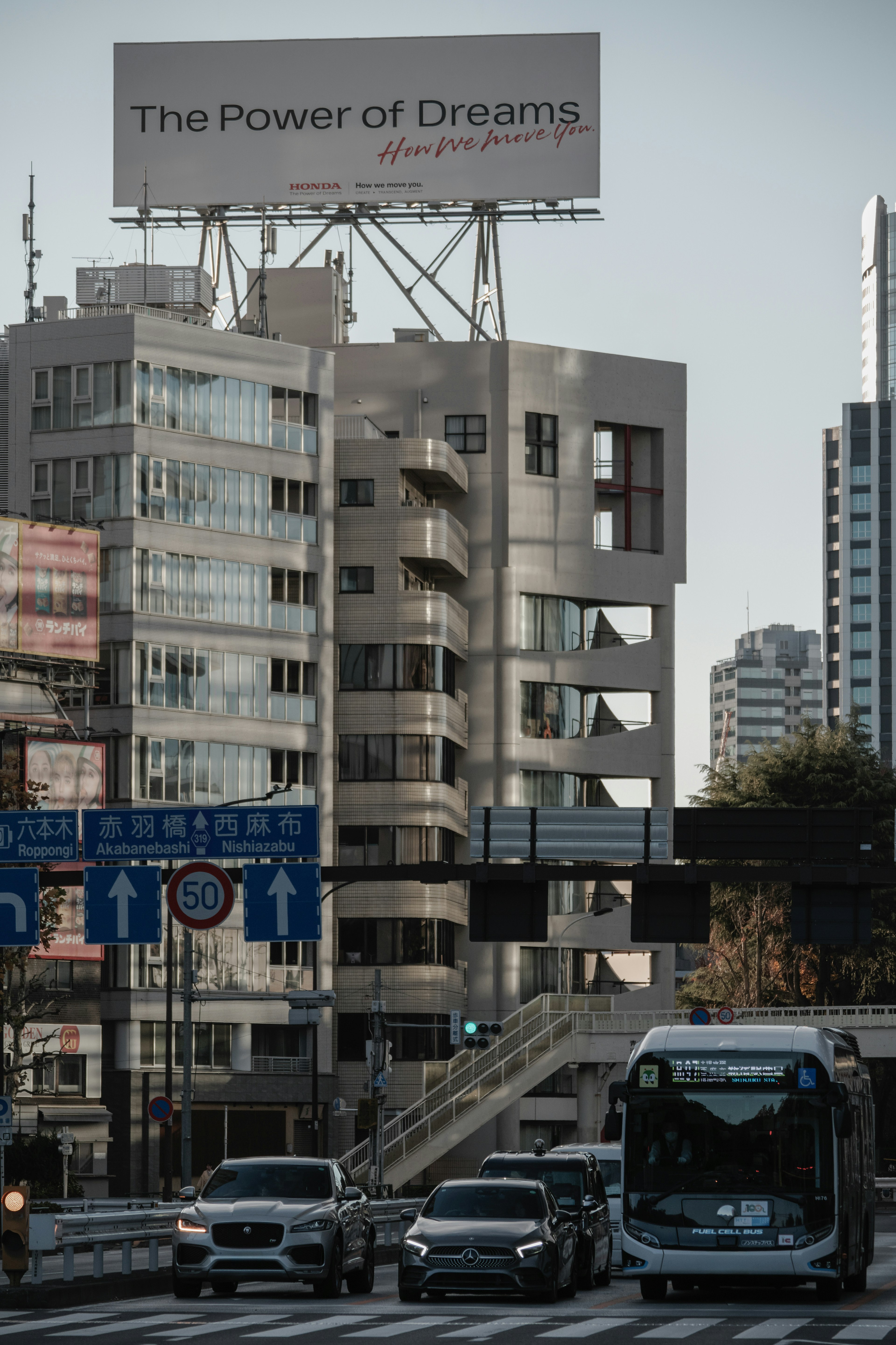 Urban landscape featuring a billboard that emphasizes the power of dreams