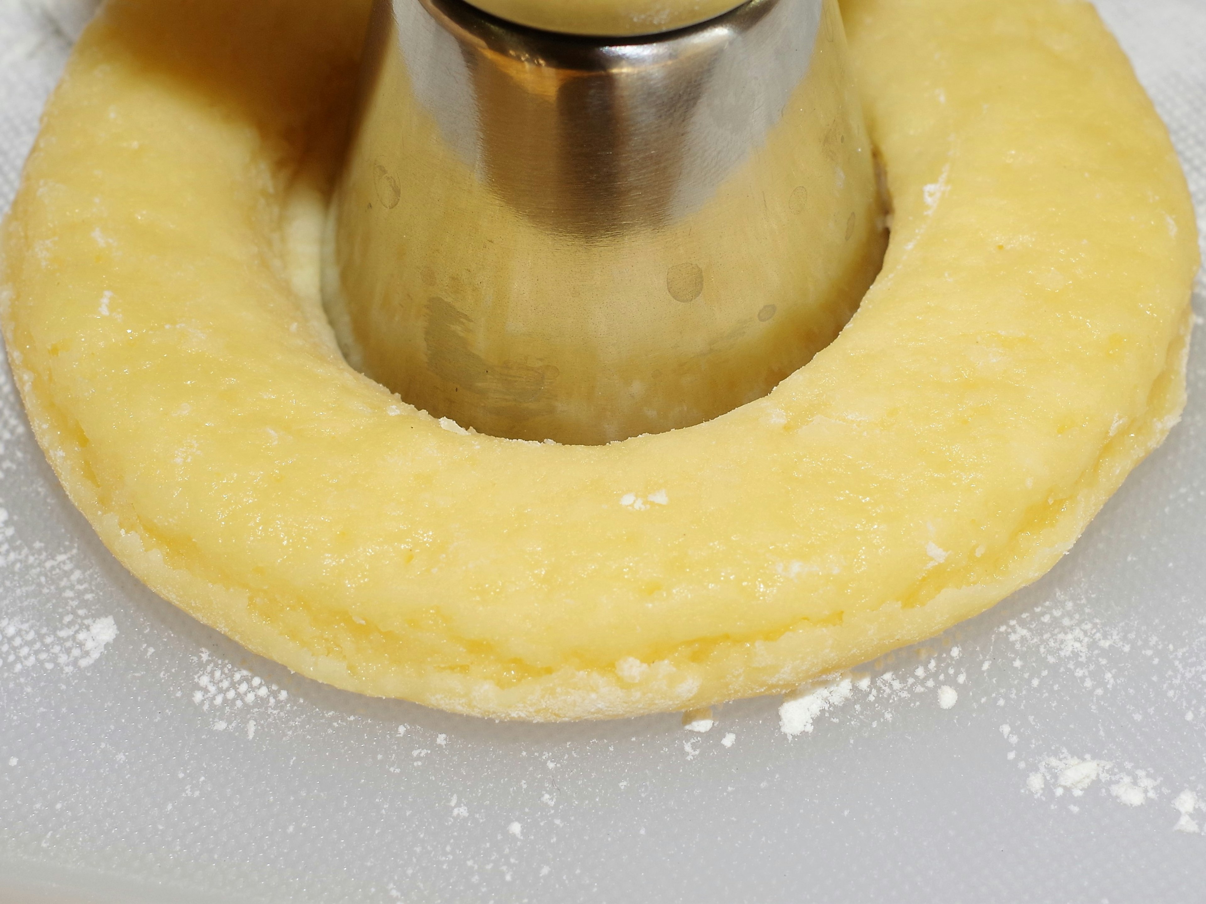 Dough shaped in a circular form surrounding a metal mold