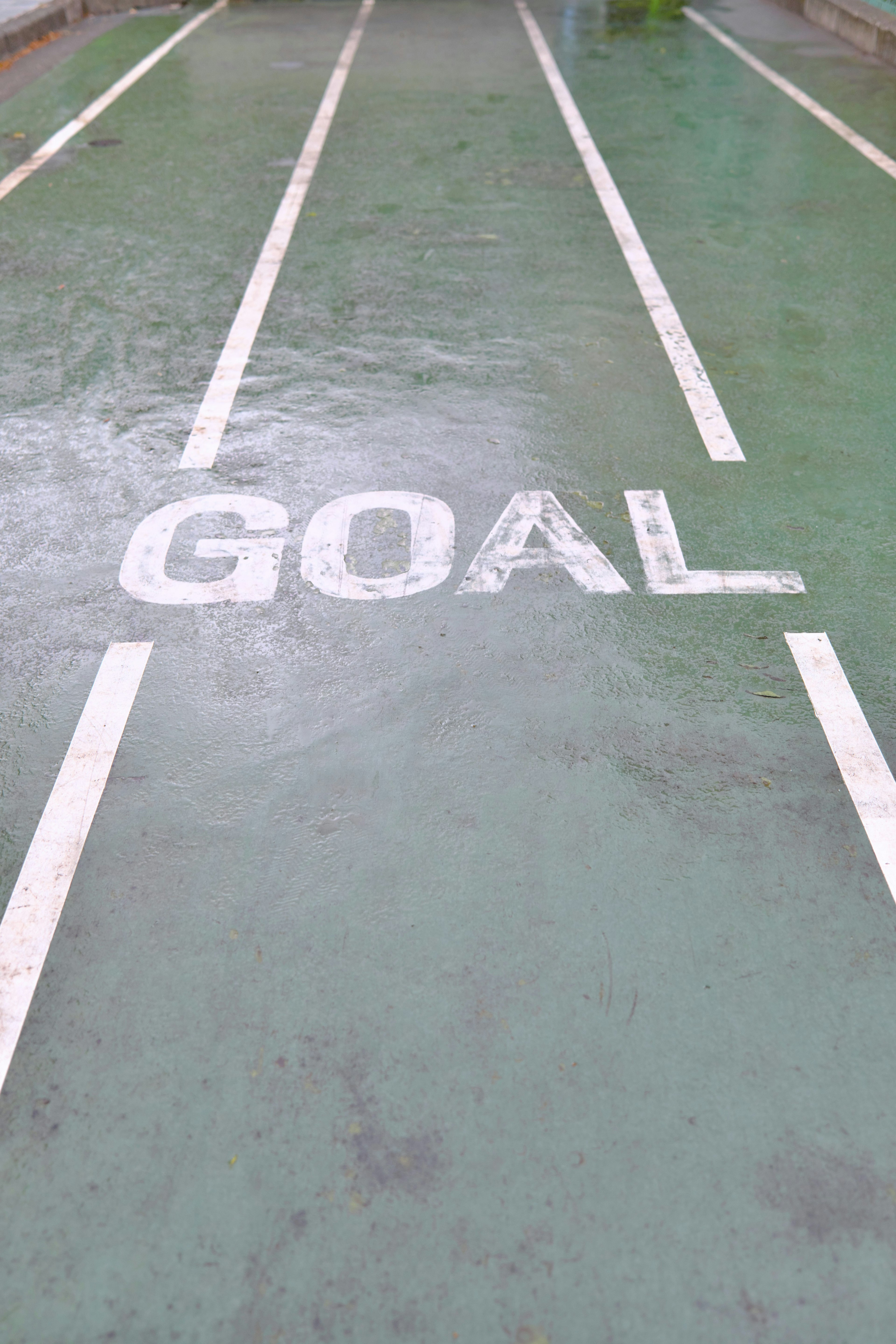 Track with the word GOAL marked on a wet surface