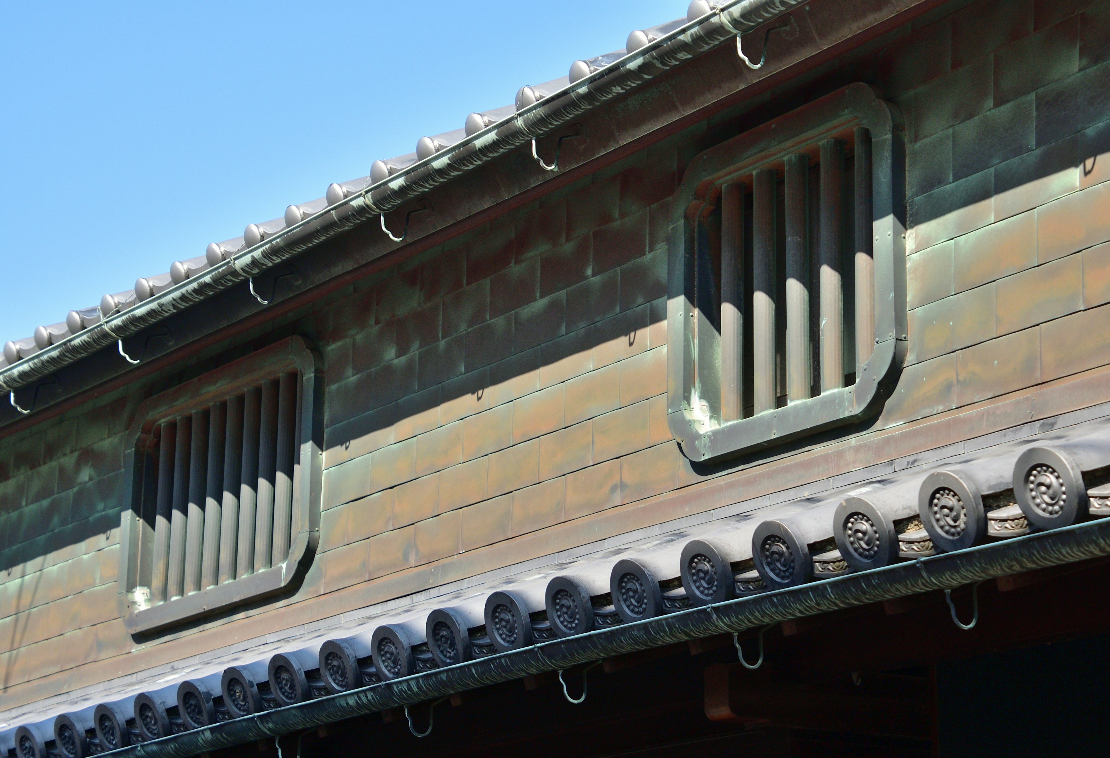 Traditional Japanese architectural details featuring windows and roof