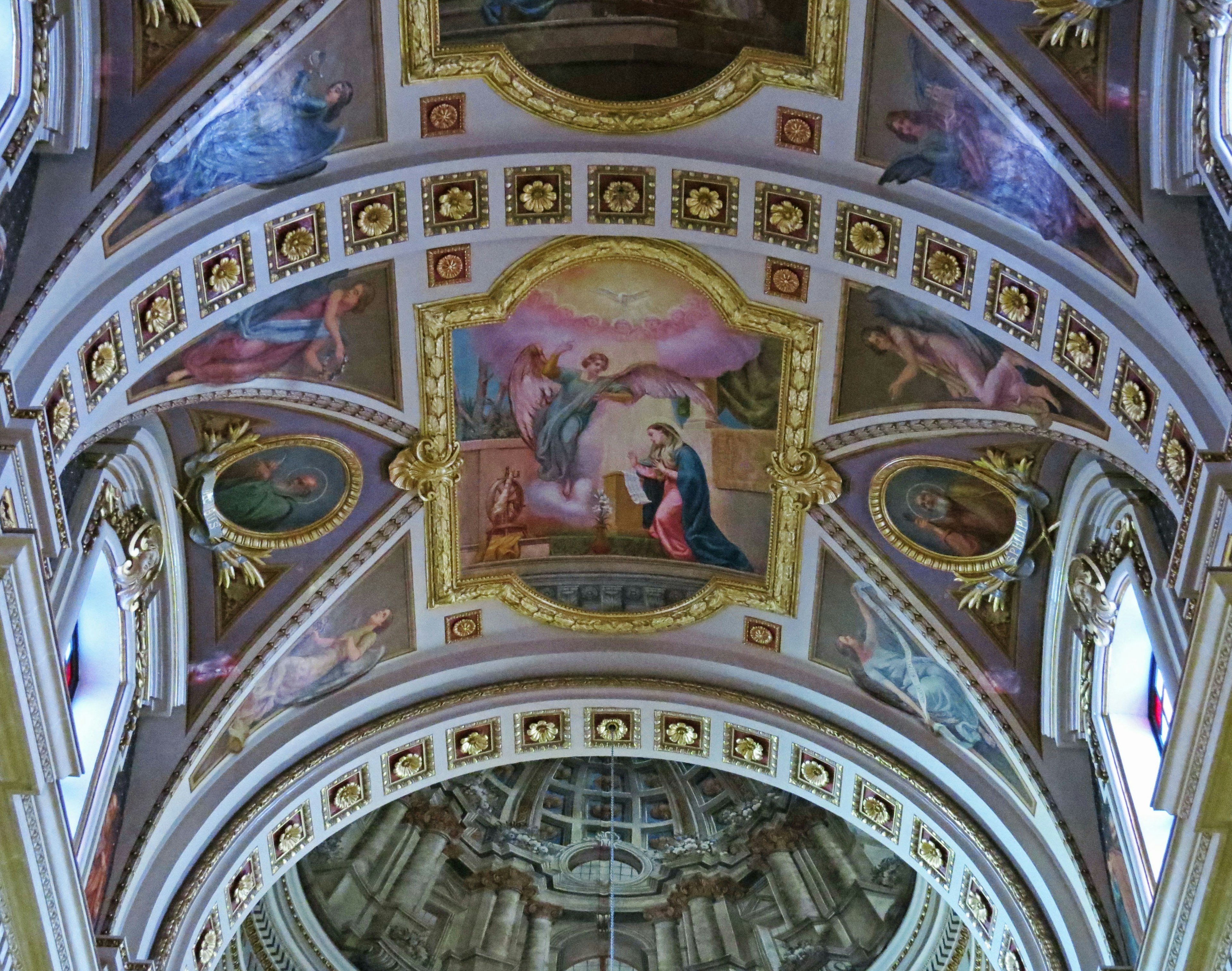 Beautiful church ceiling with ornate decorations and paintings