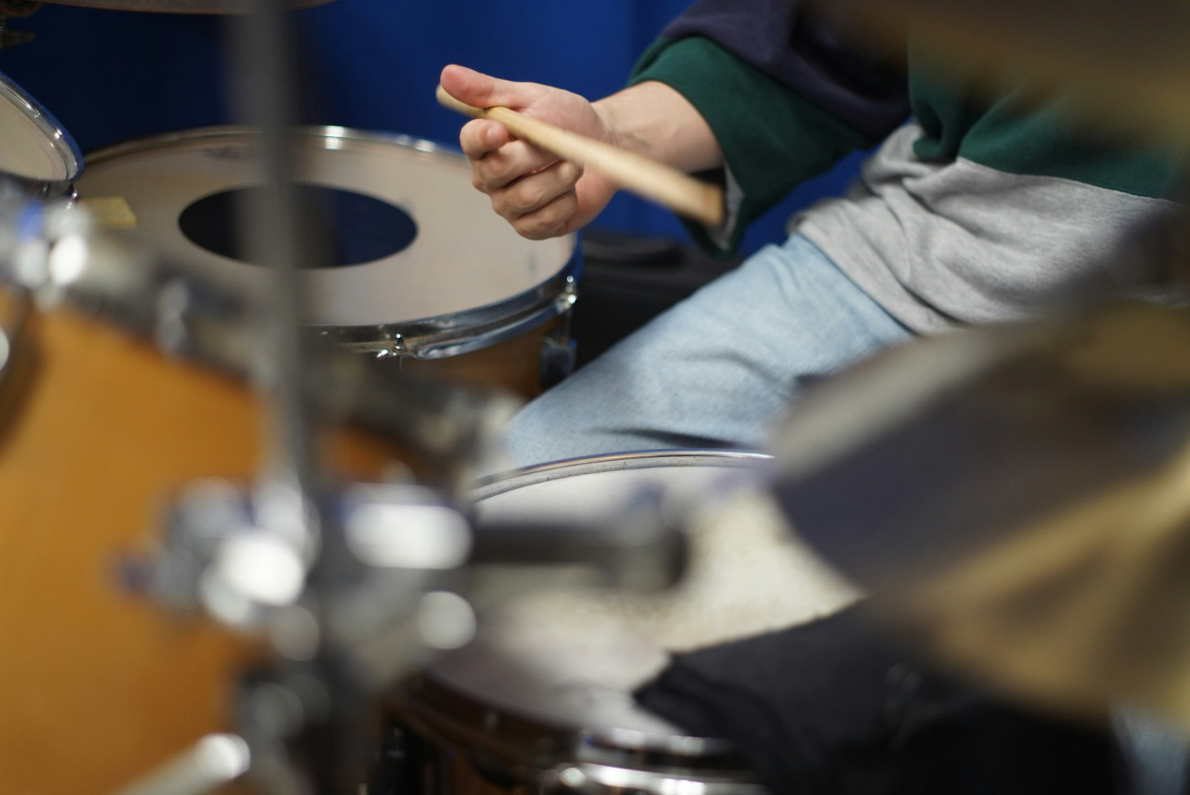 Close-up of hands playing drums