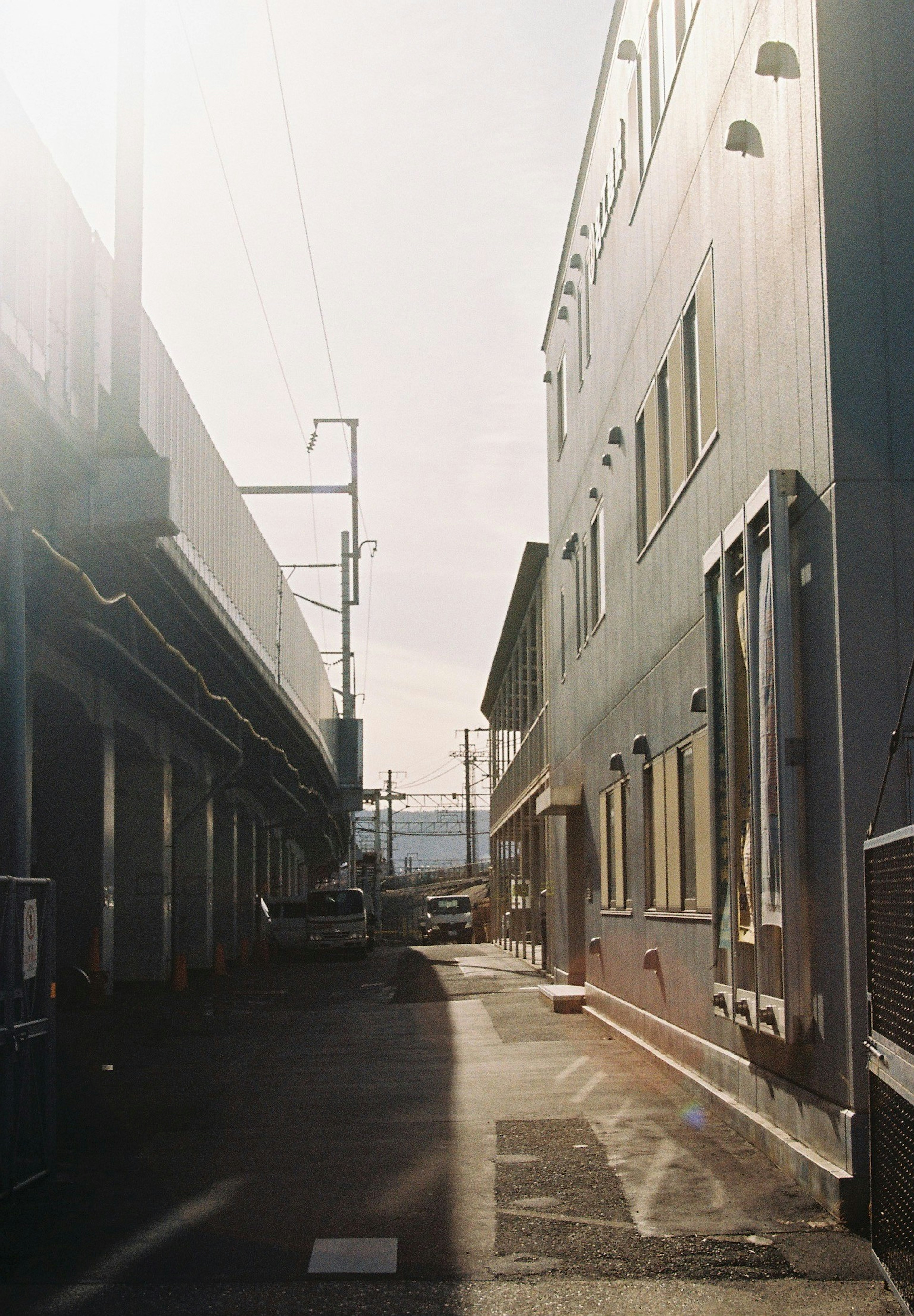 Narrow alley with buildings and utility poles