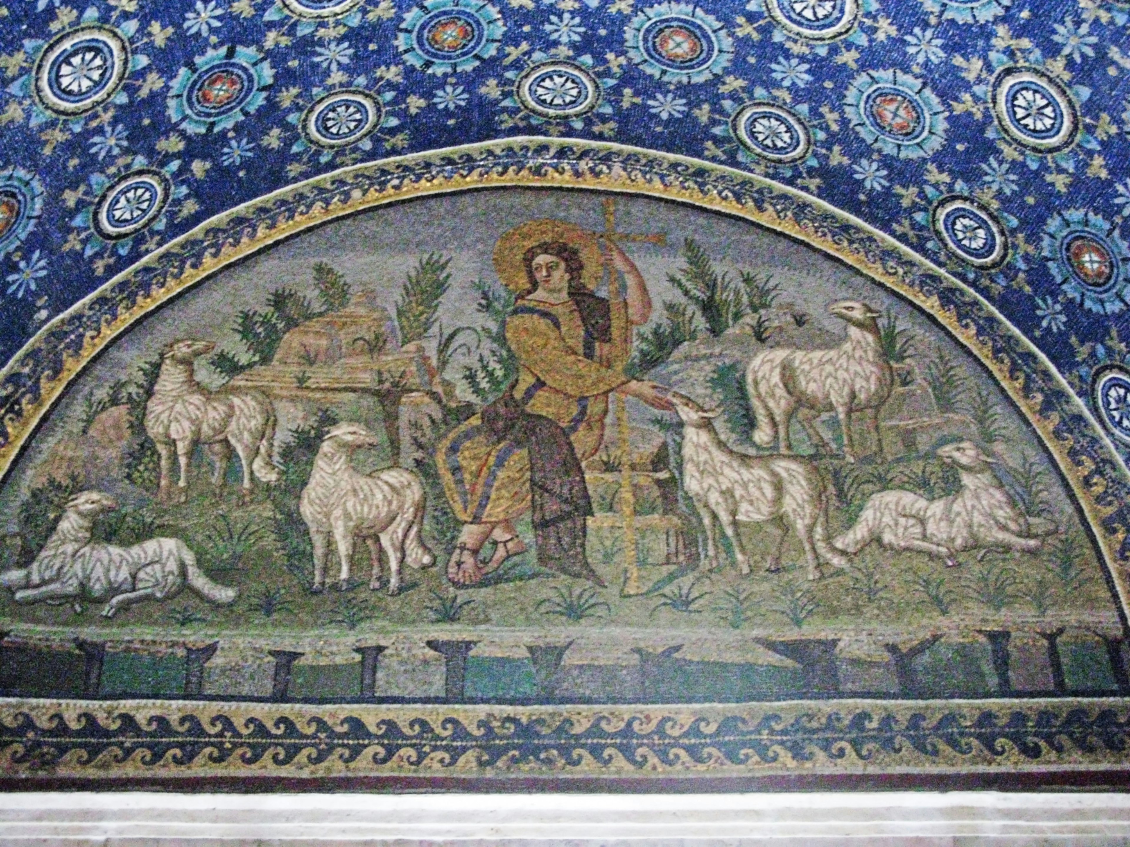 Mosaic depicting a shepherd with sheep against a blue background