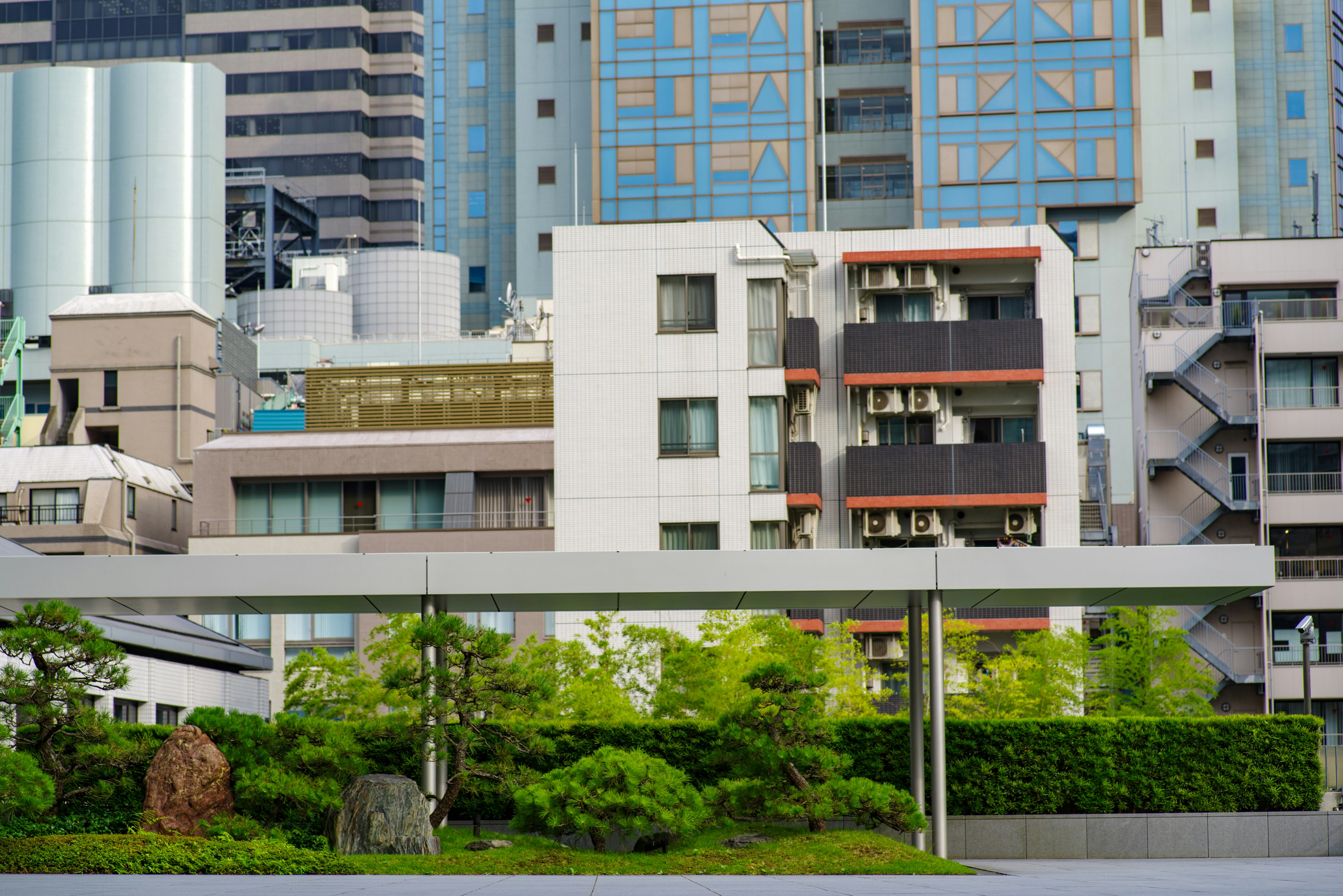 Urban landscape featuring a mix of modern buildings and greenery