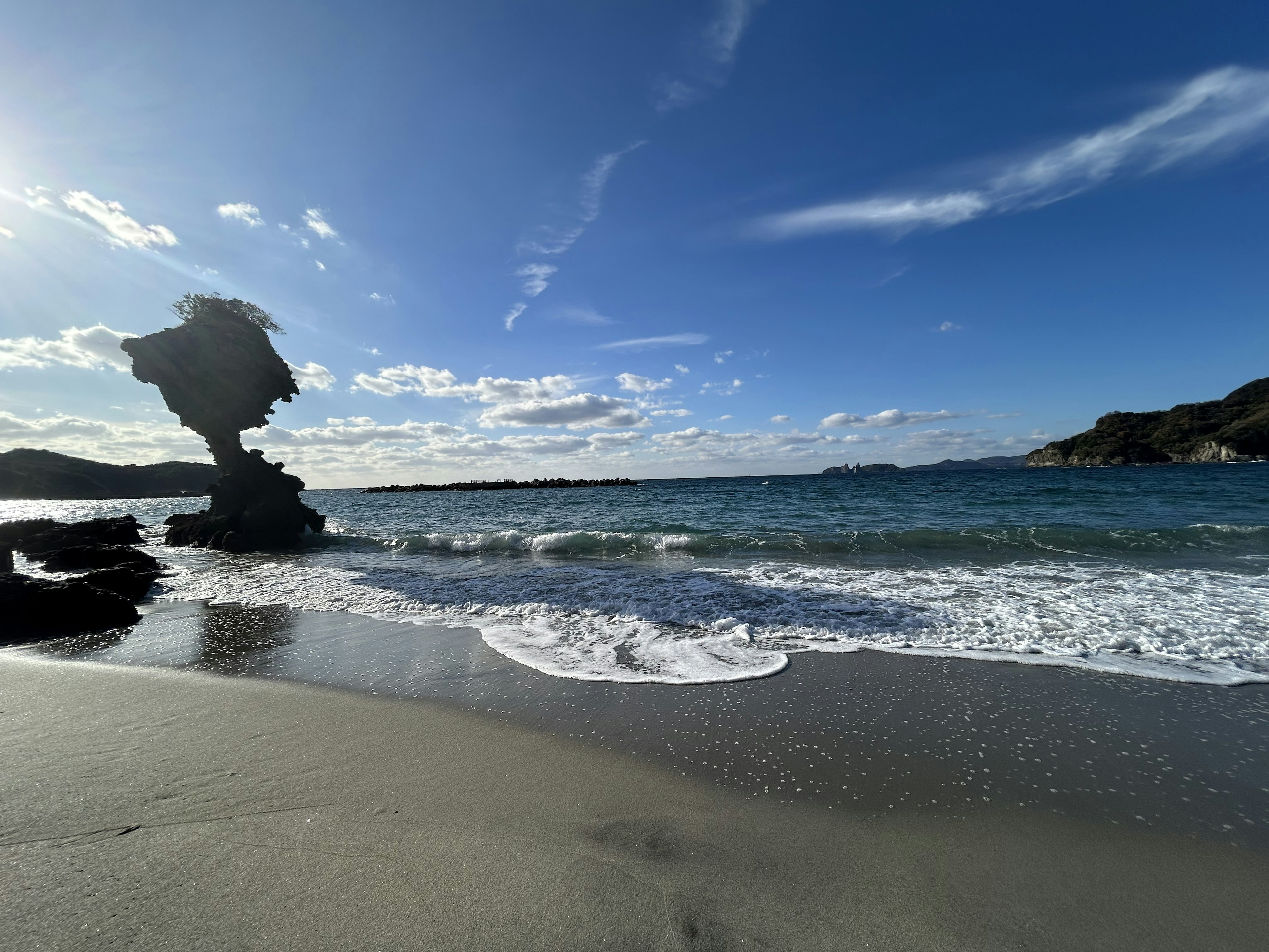 Coastal view featuring rock formations and waves