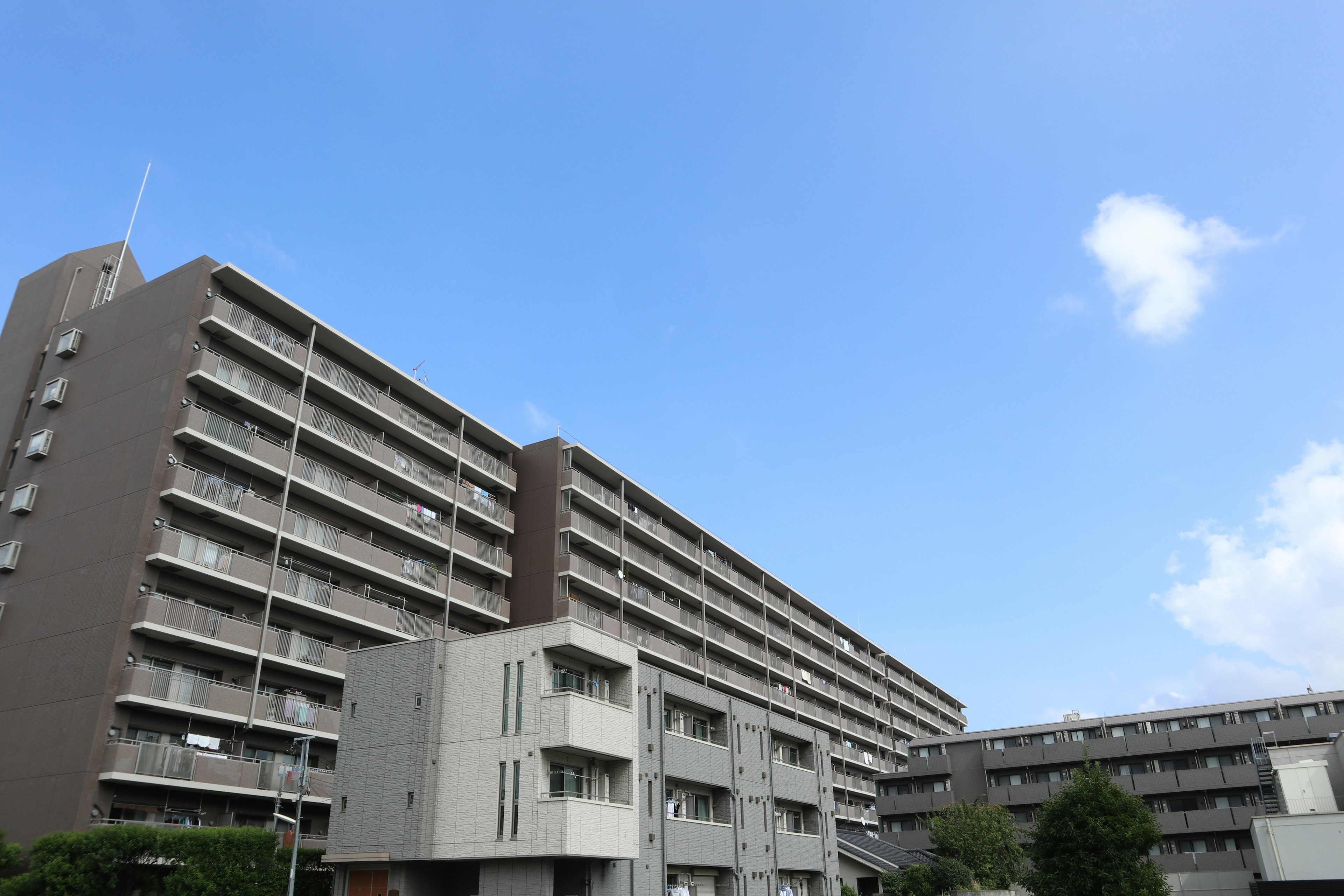 Modern apartment buildings under a clear blue sky