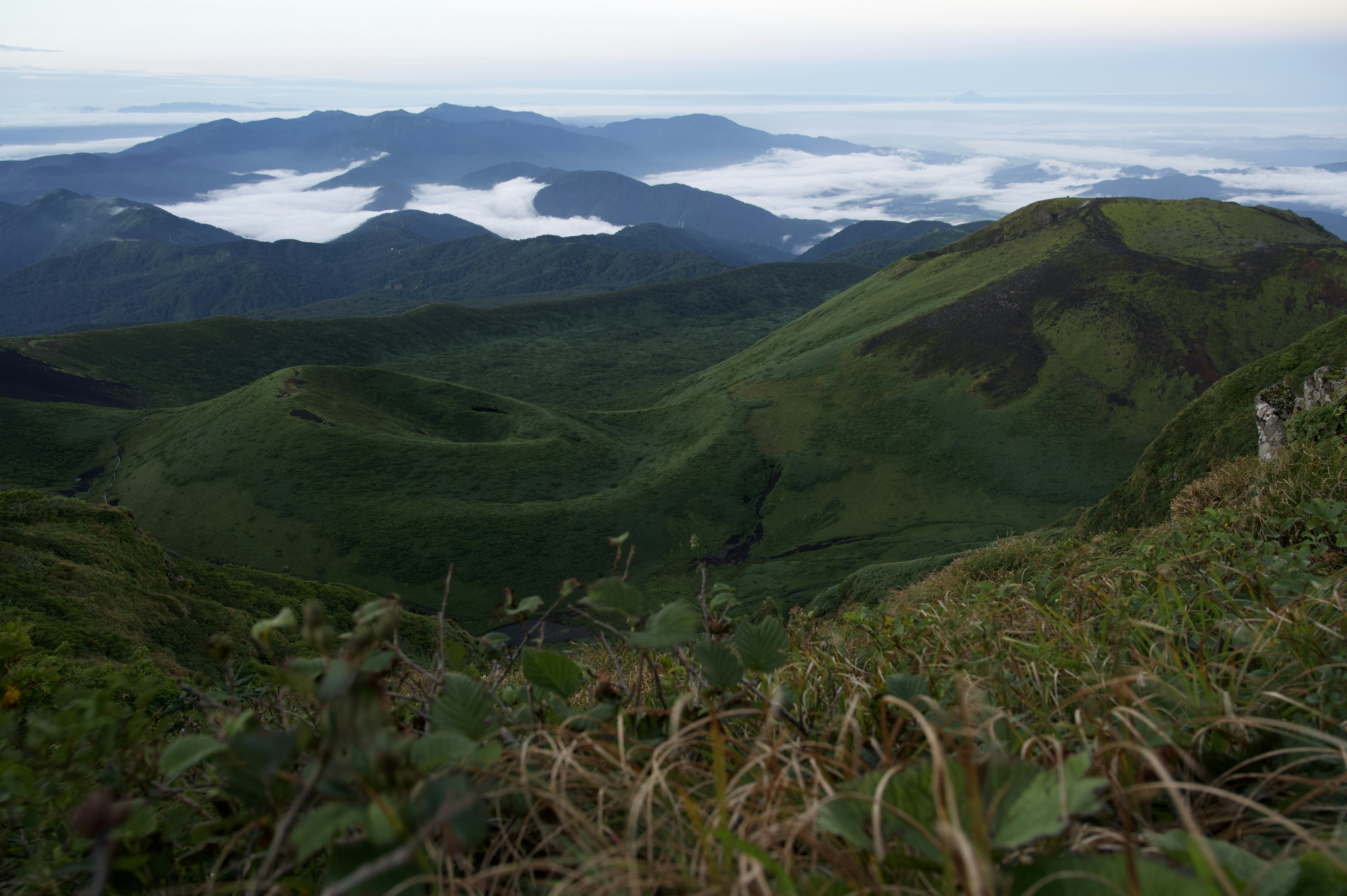 Lush green mountains with a stunning sea of clouds