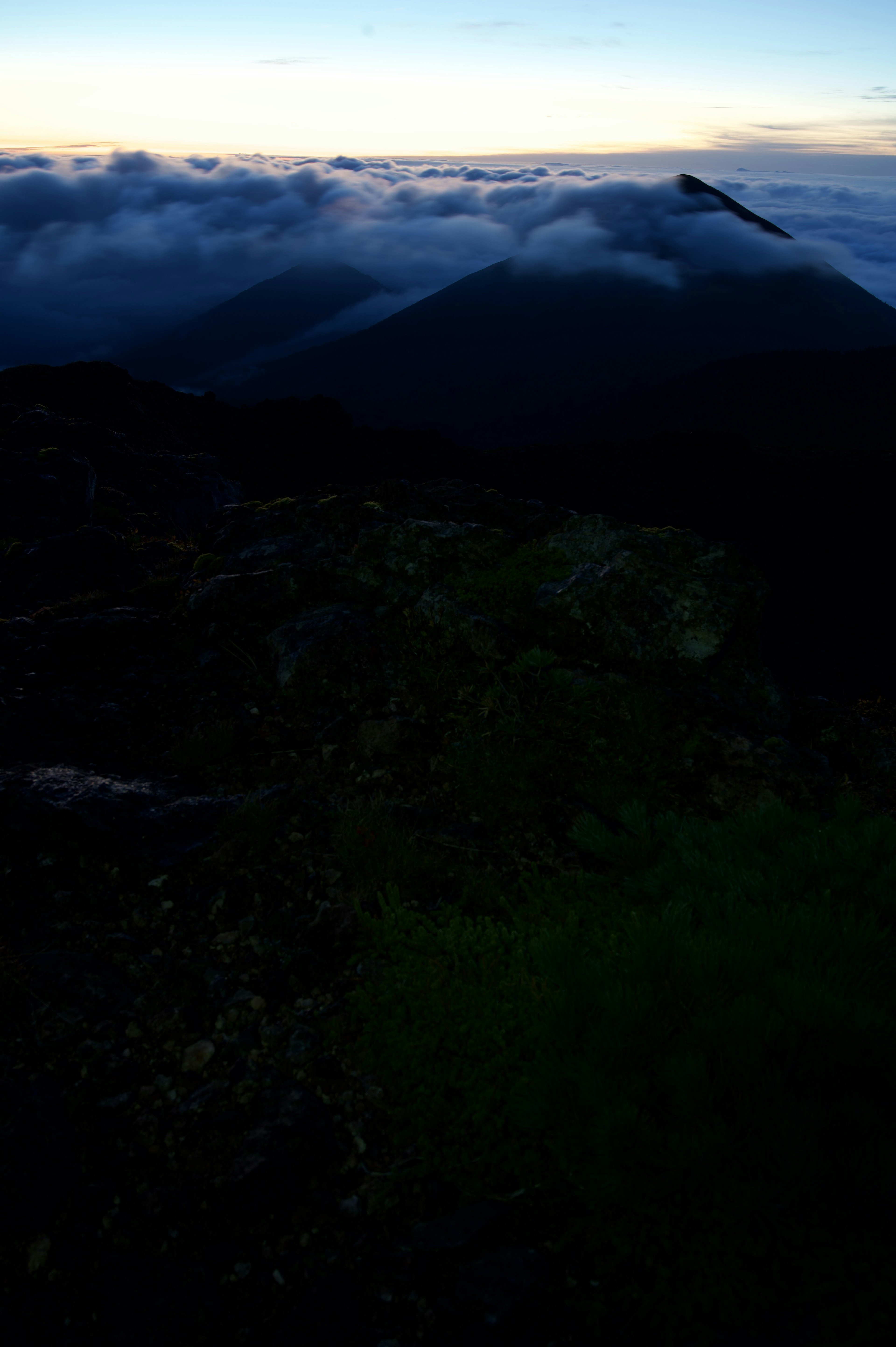 Dramatic mountain landscape with clouds at dusk