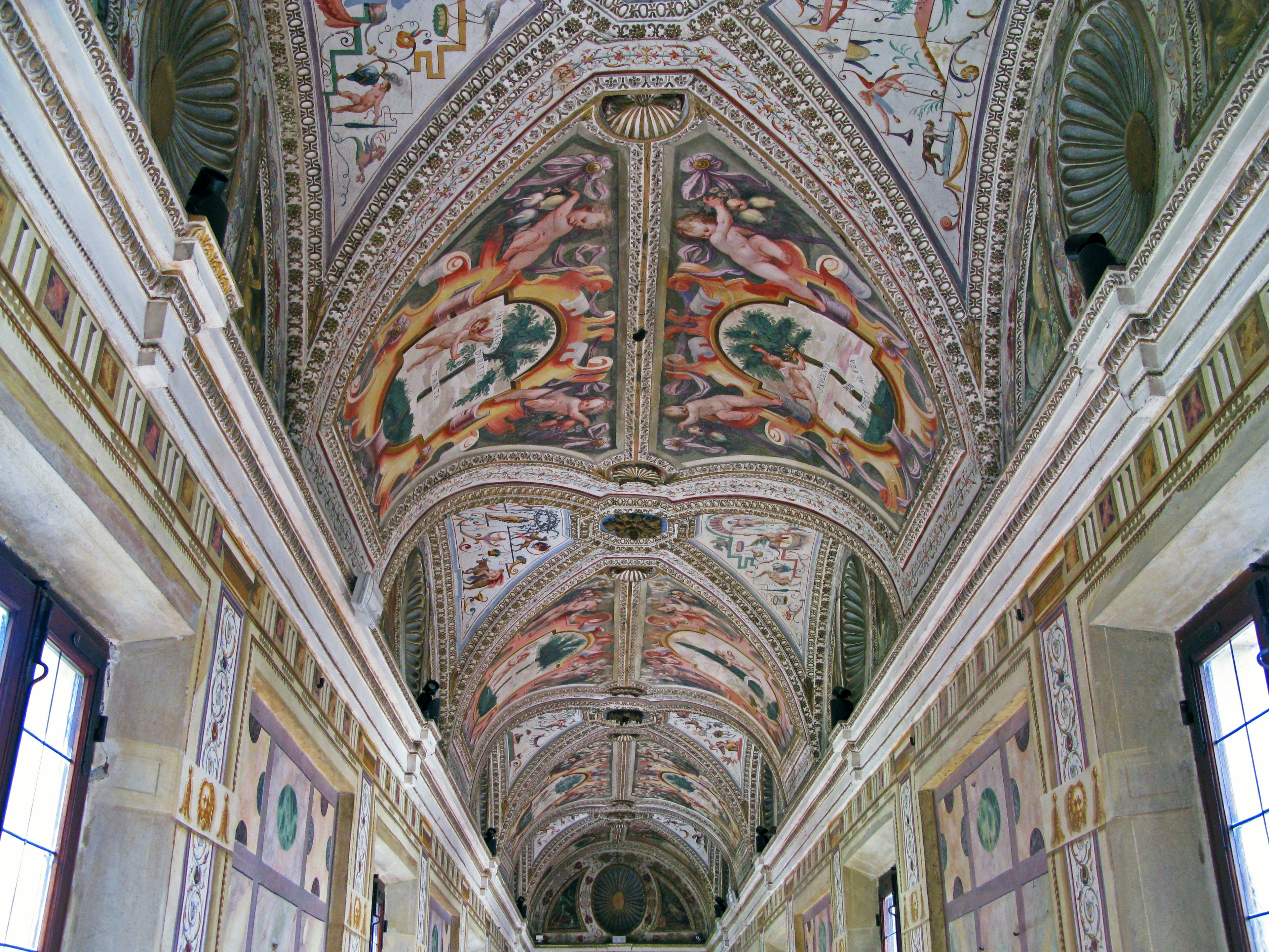 Beautifully decorated ceiling with frescoes and ornate details