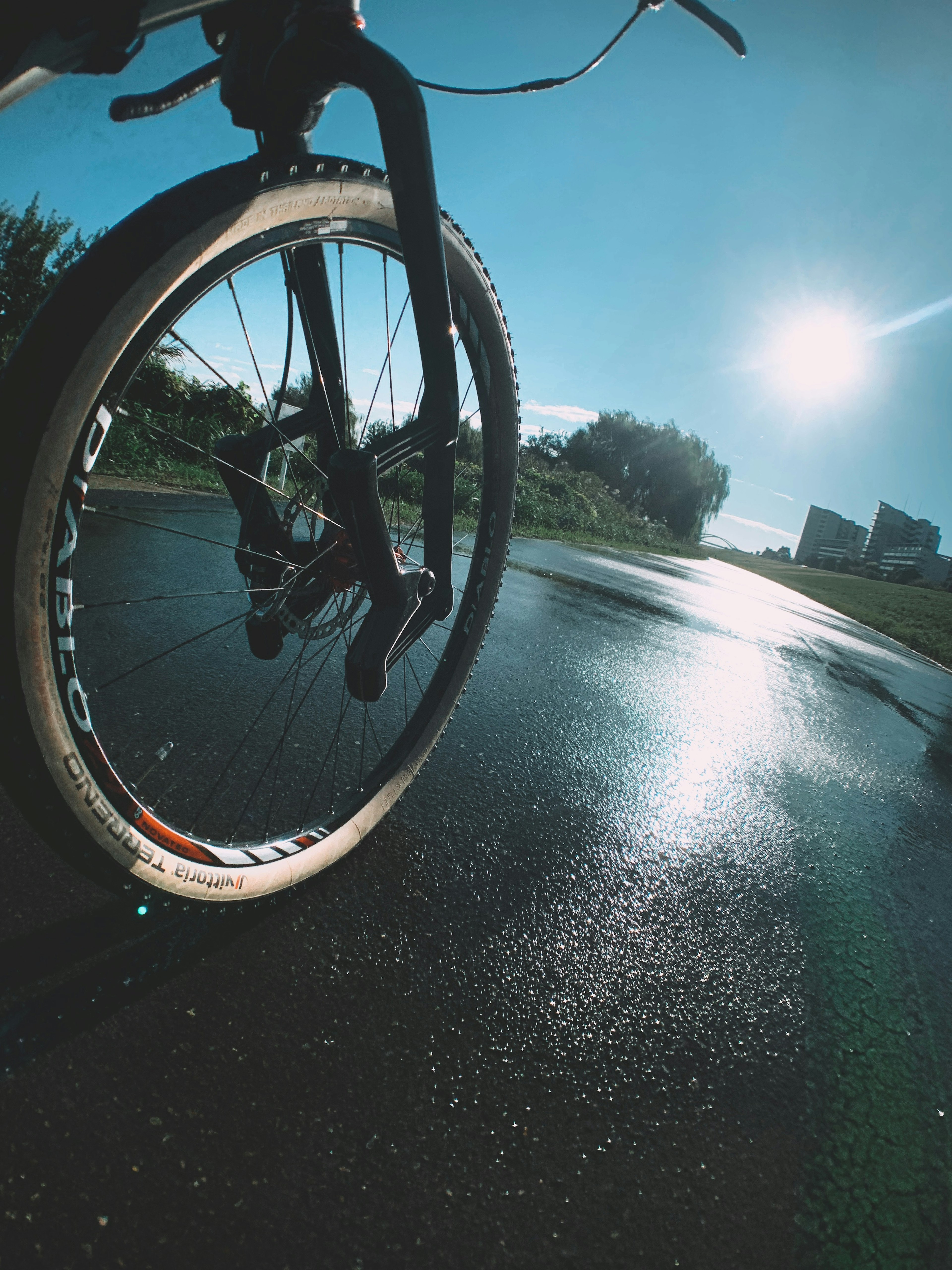 Close-up of a bicycle tire with a clear blue sky