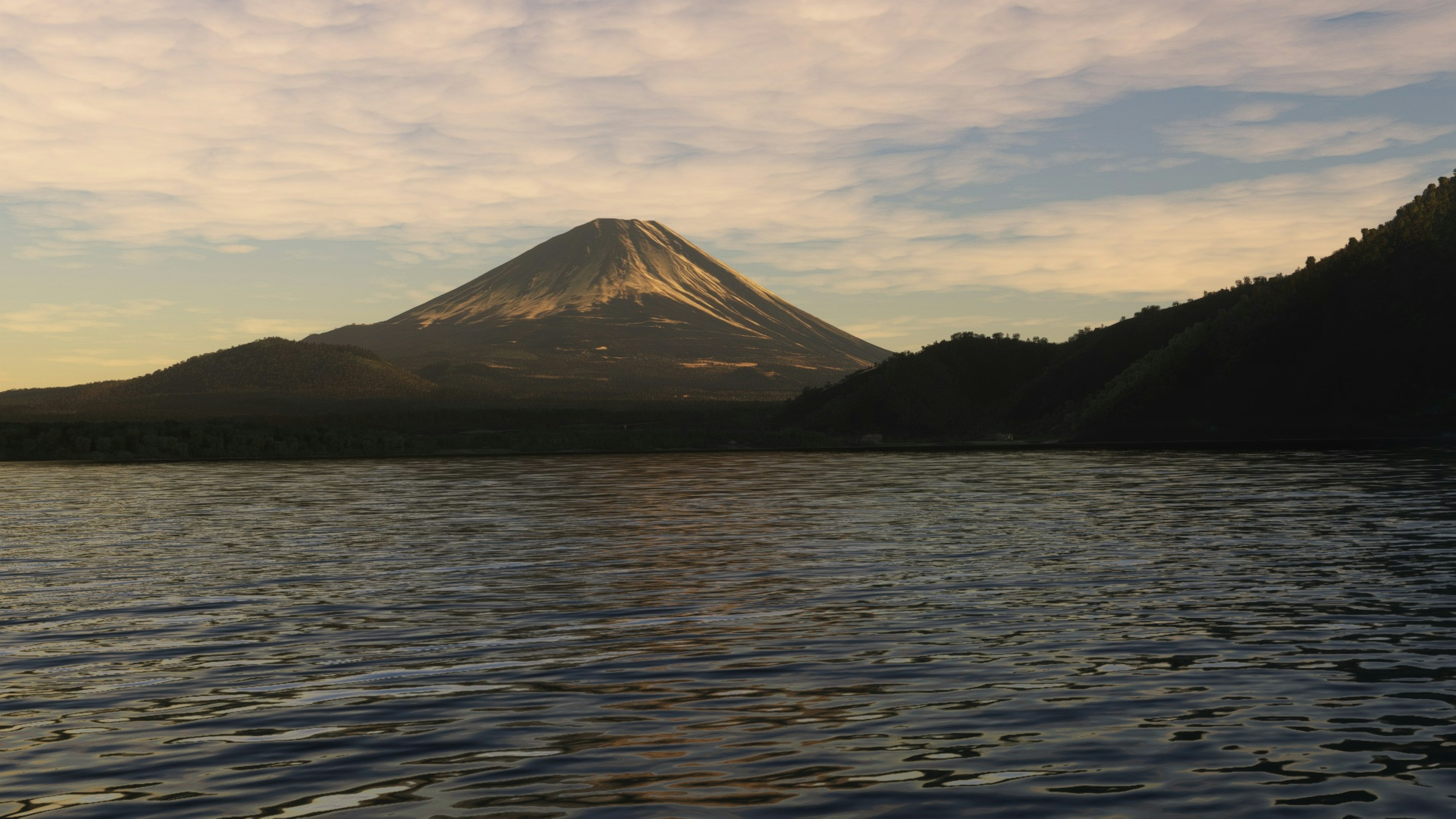 Vista del monte Fuji cerca de un lago sereno con superficie reflectante y cielo suave