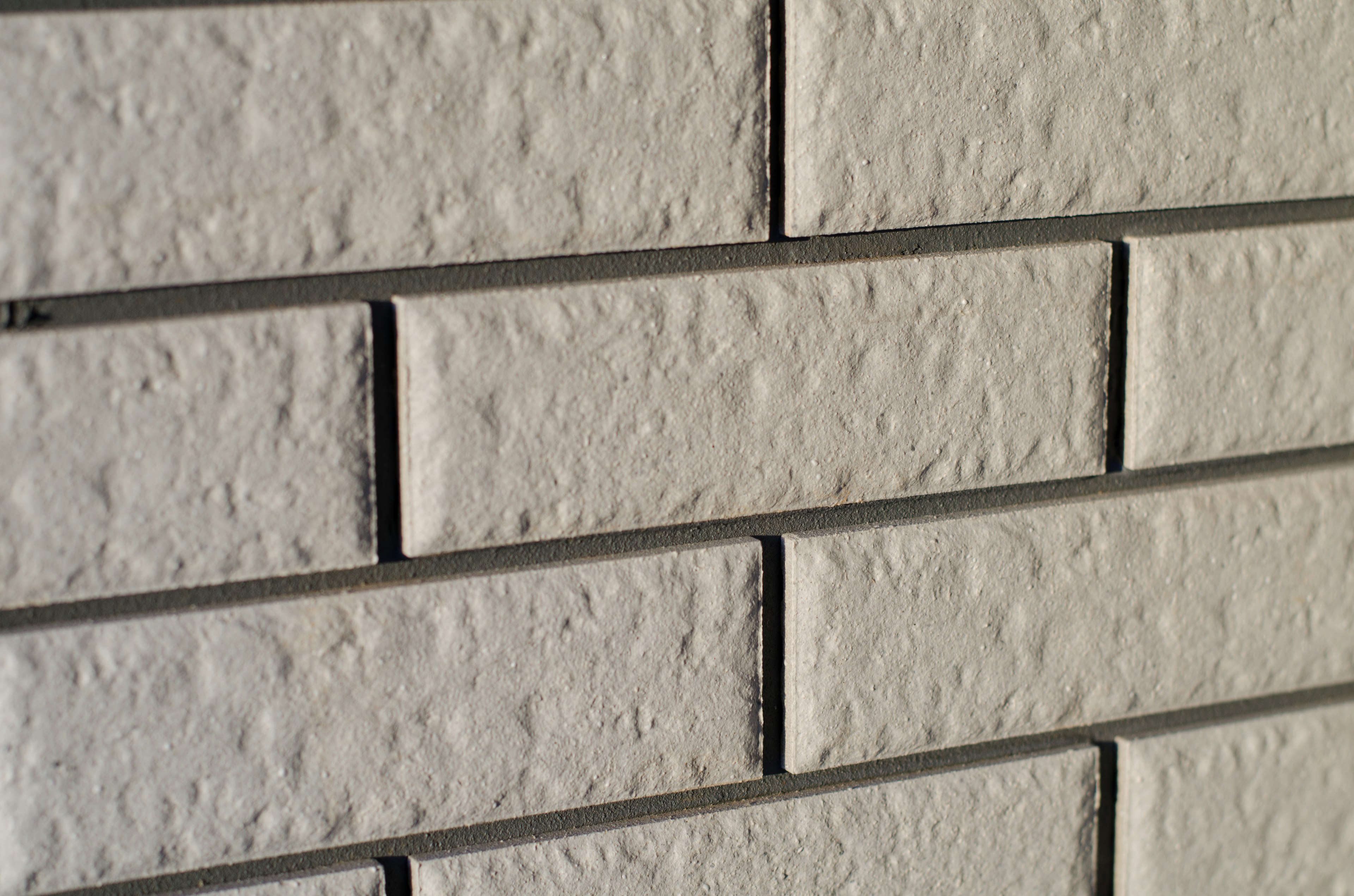 Close-up of textured white brick wall