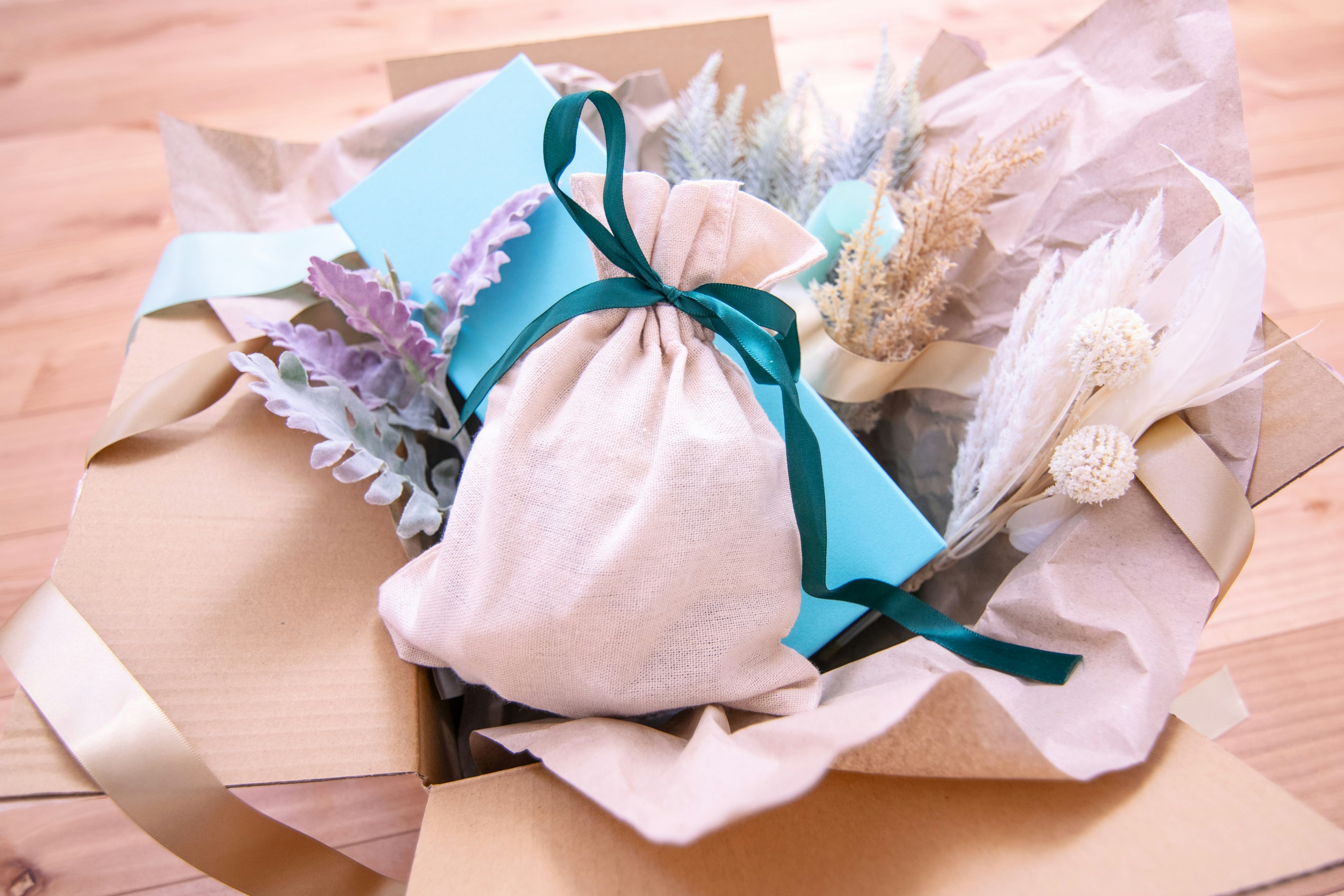 Wrapped gift and dried flower arrangement