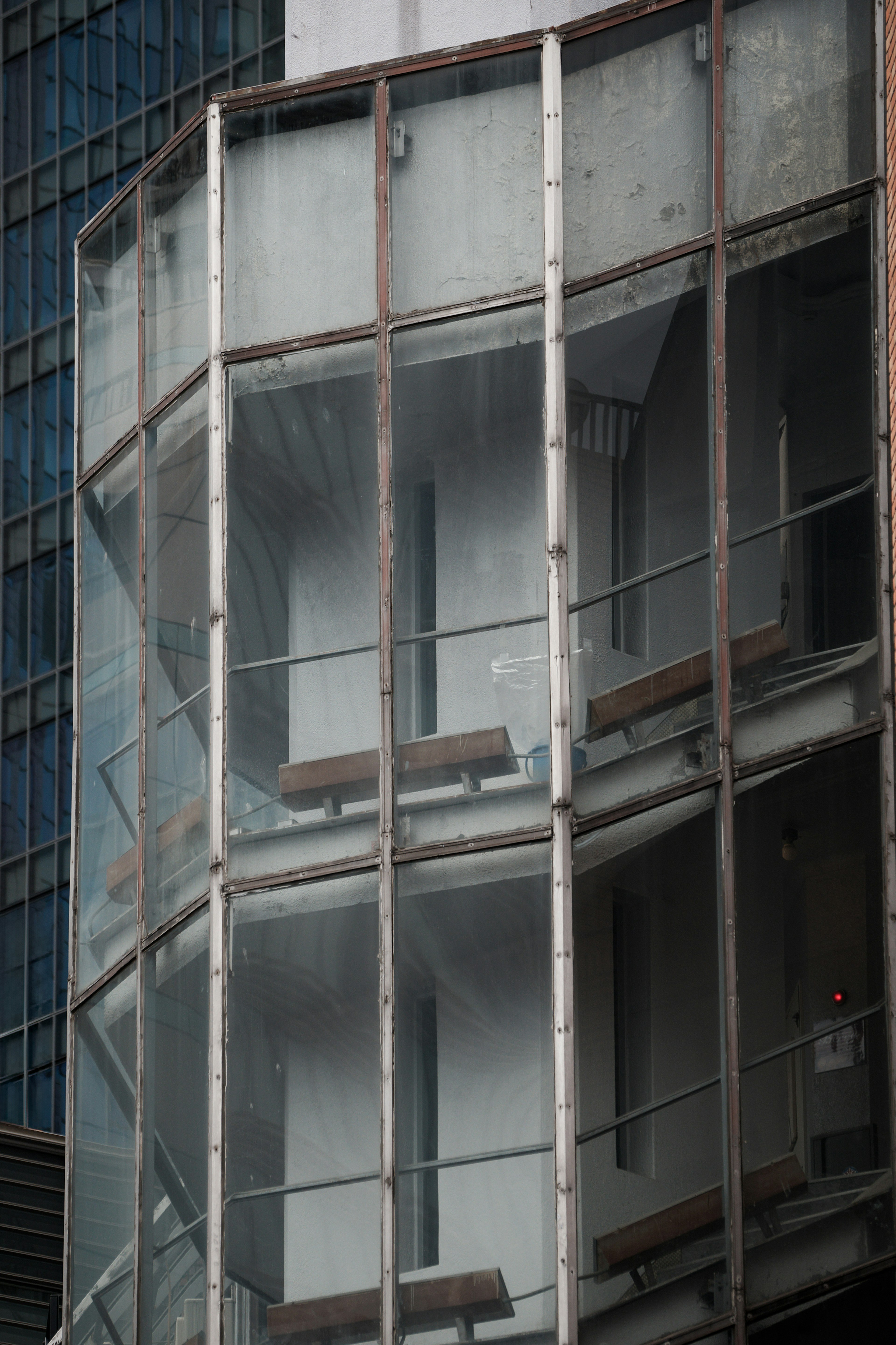 Modern building section featuring glass balconies