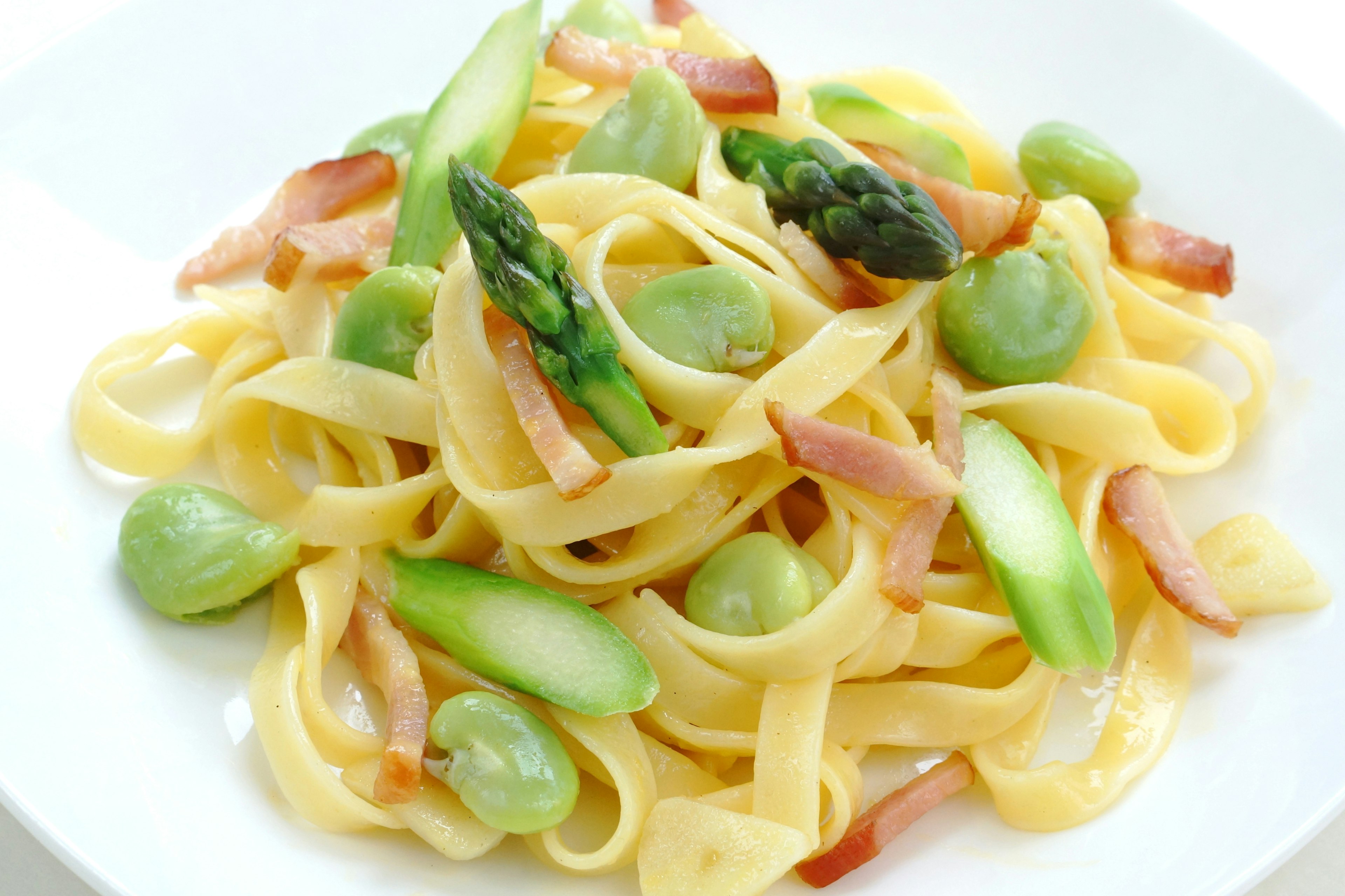 Creamy pasta topped with asparagus and green beans