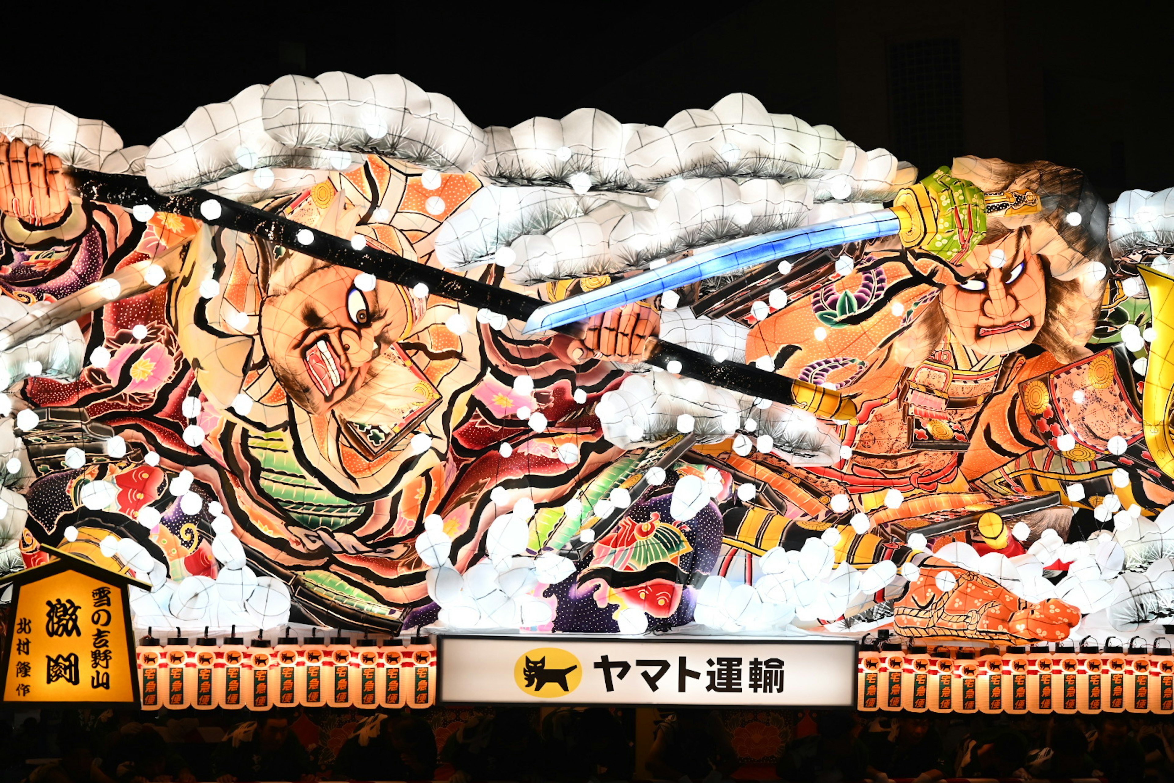 Three-dimensional ukiyo-e style decoration of warriors fighting with large lanterns