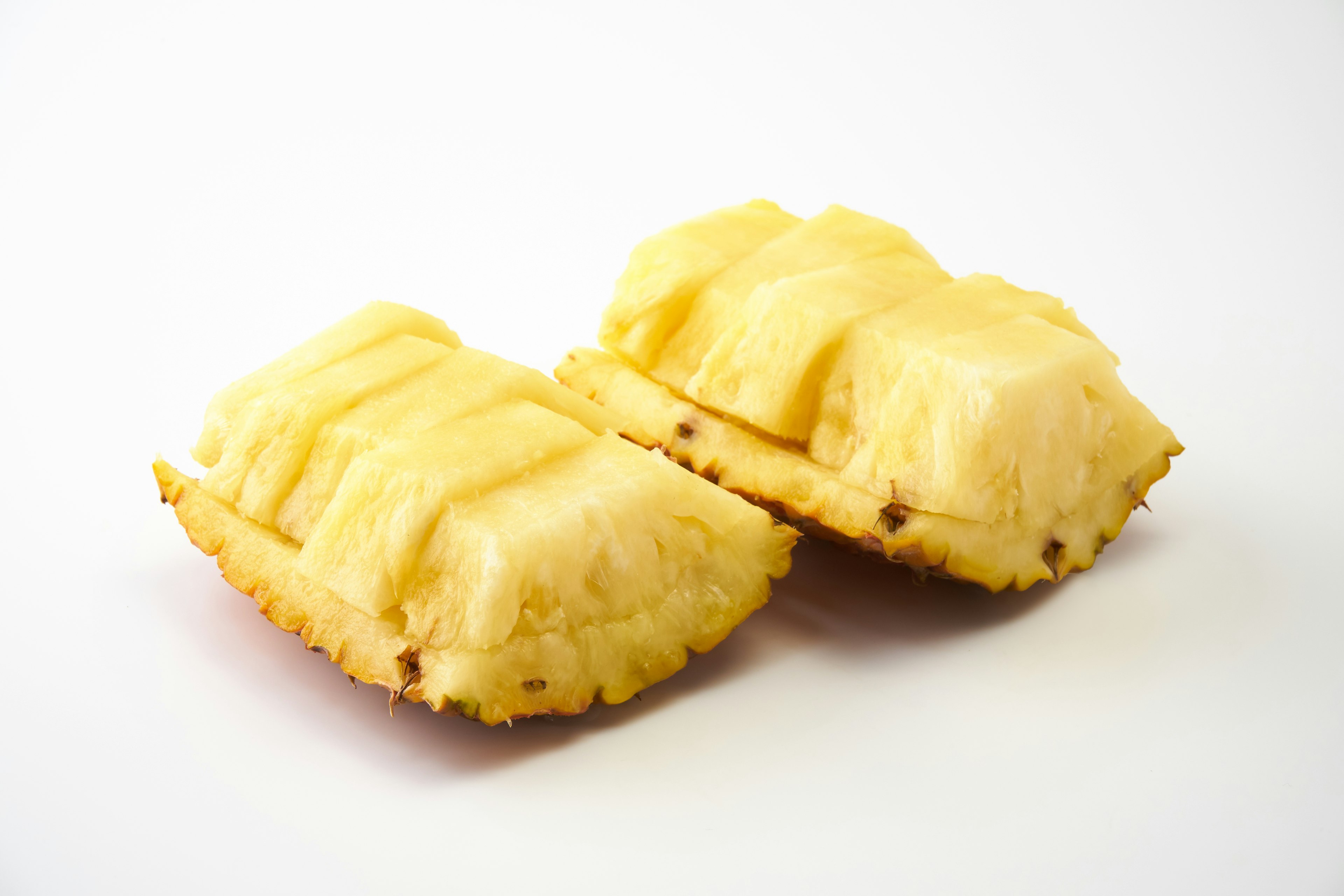 Two pineapple cakes placed on a white background