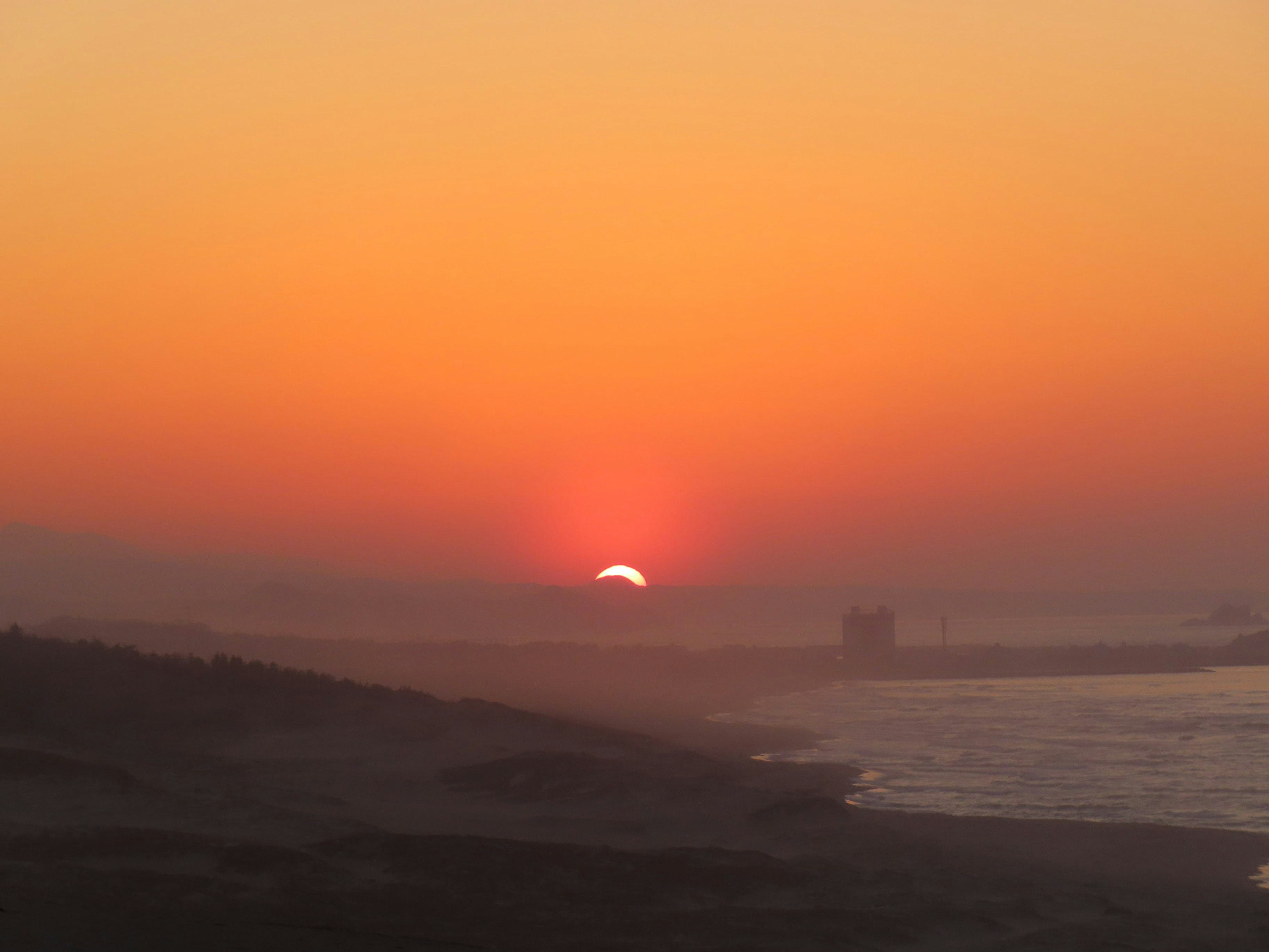 Beautiful sunset over the ocean with orange sky