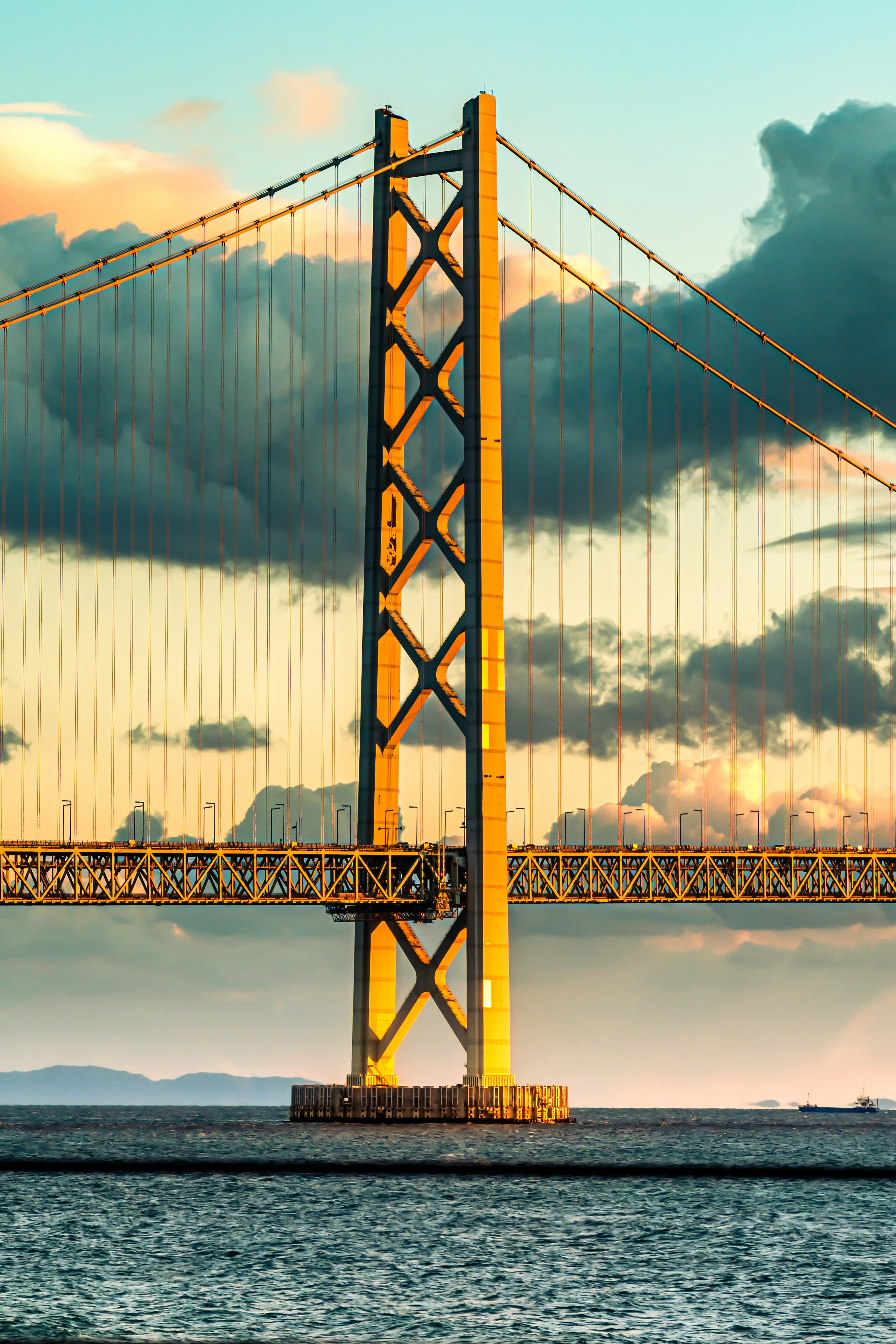 Part of a beautiful bridge stands under a sunset sky