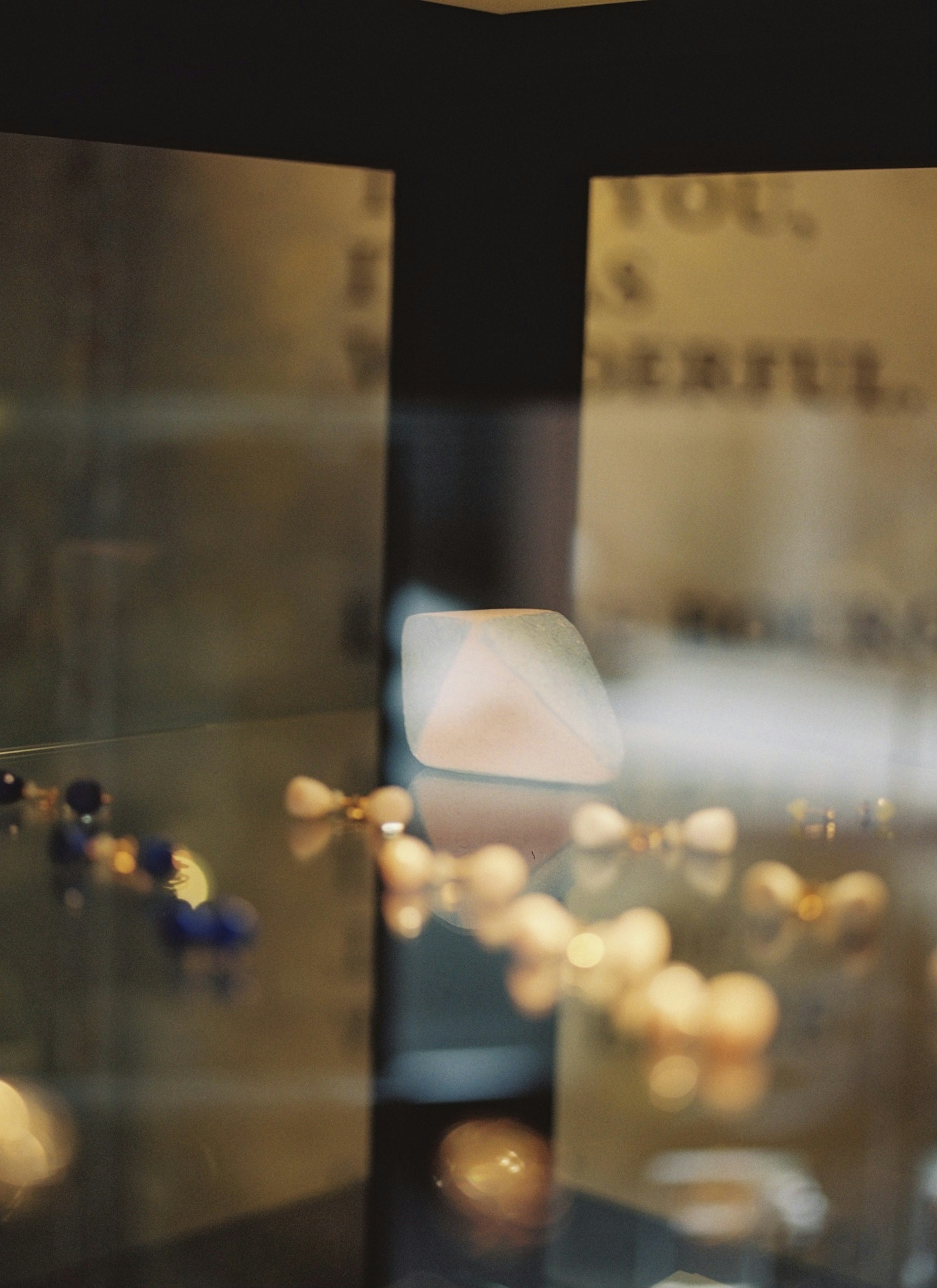 Blurred image of a jewelry display case showcasing beautiful pieces