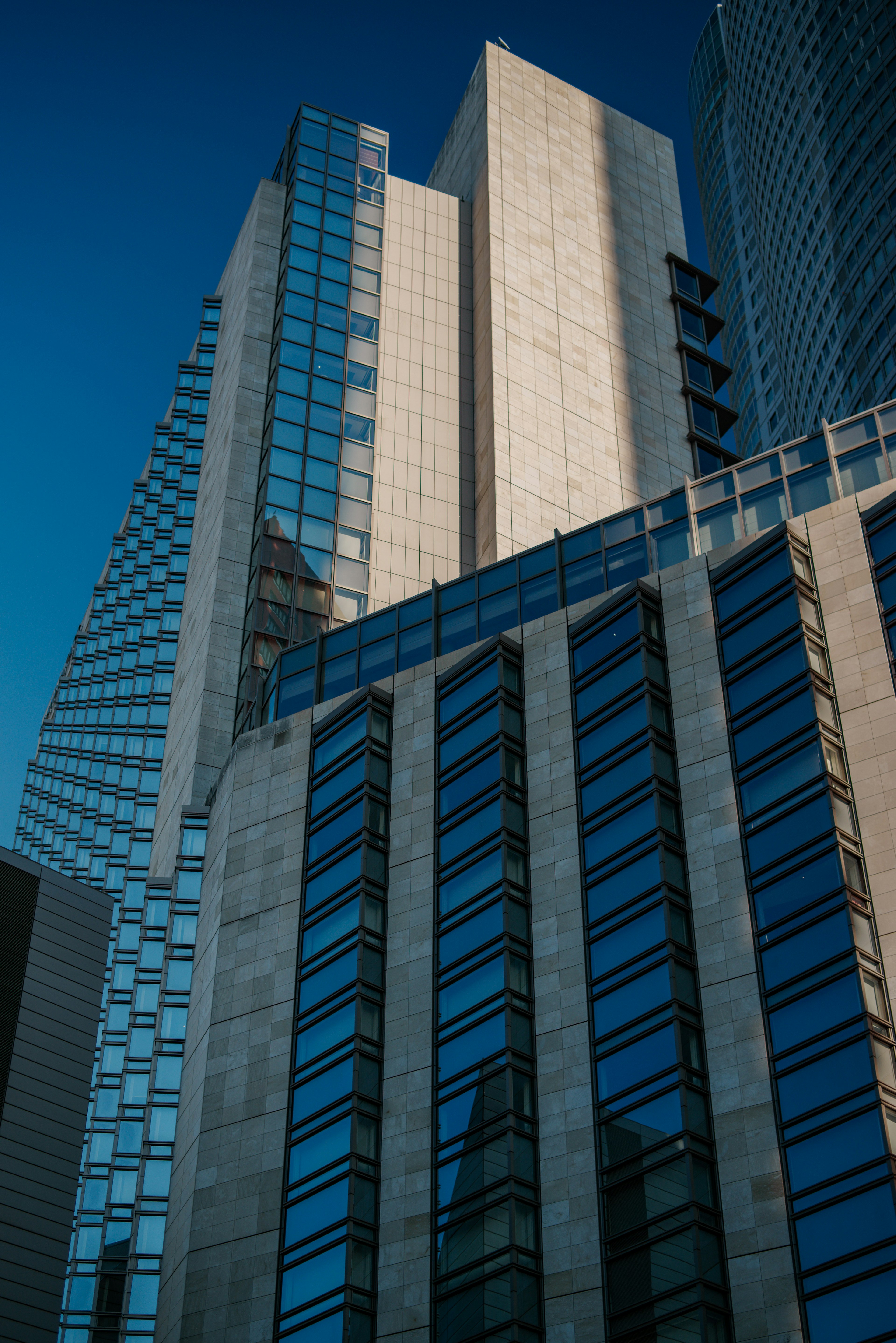 Urban skyline featuring modern skyscrapers with reflective glass and unique architectural designs