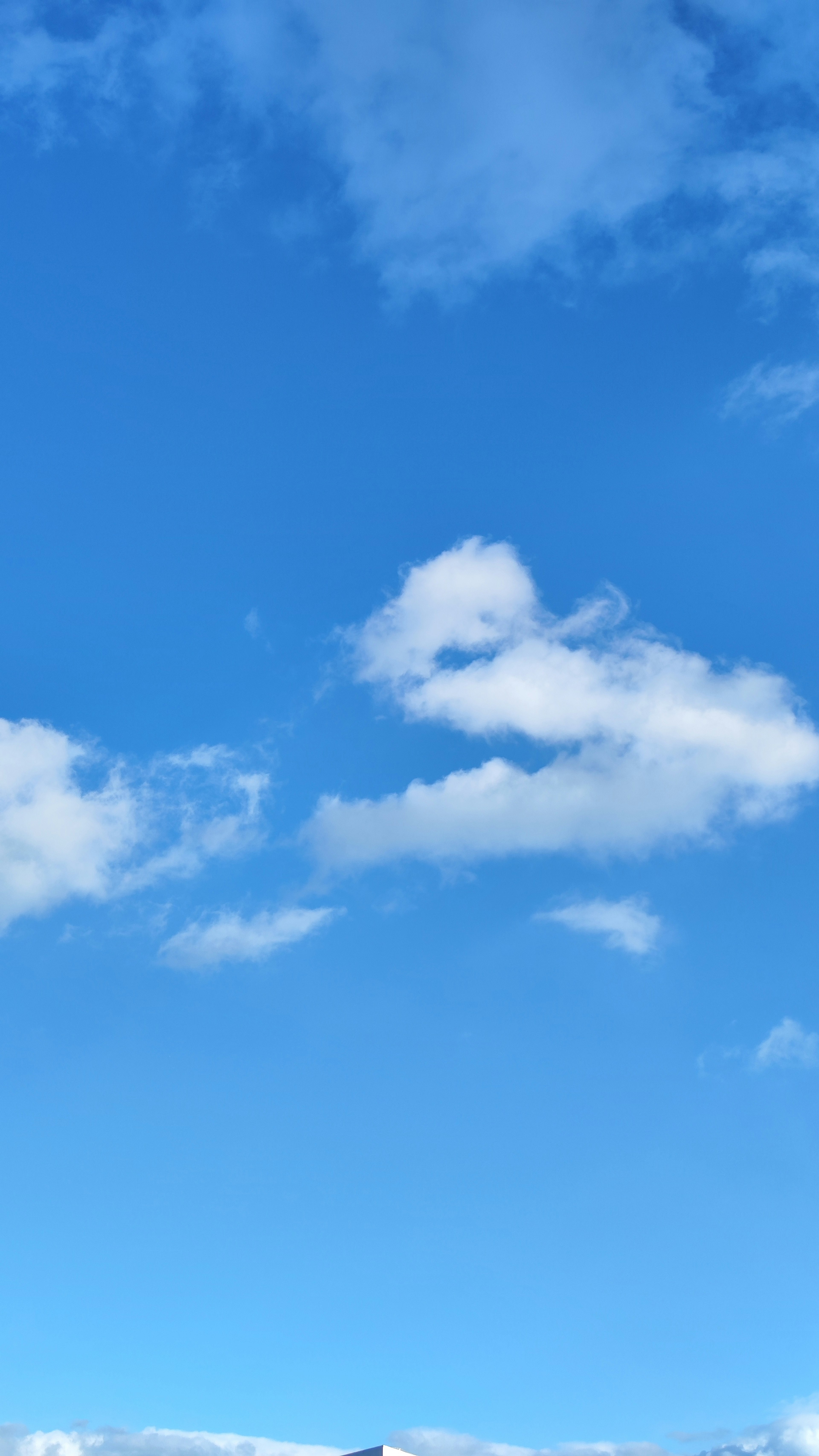 White clouds floating in a clear blue sky