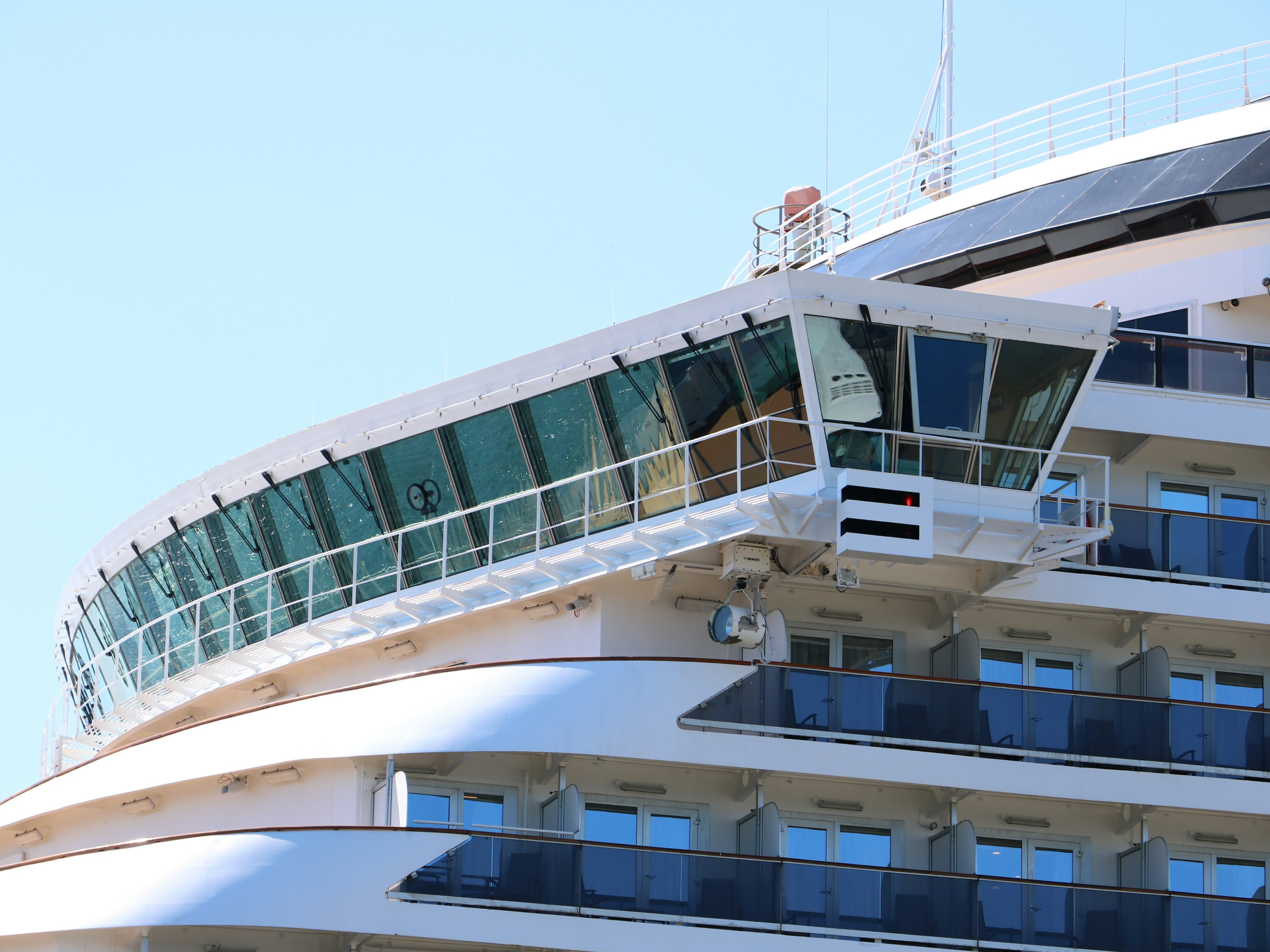 Close-up of a cruise ship's bridge and balconies