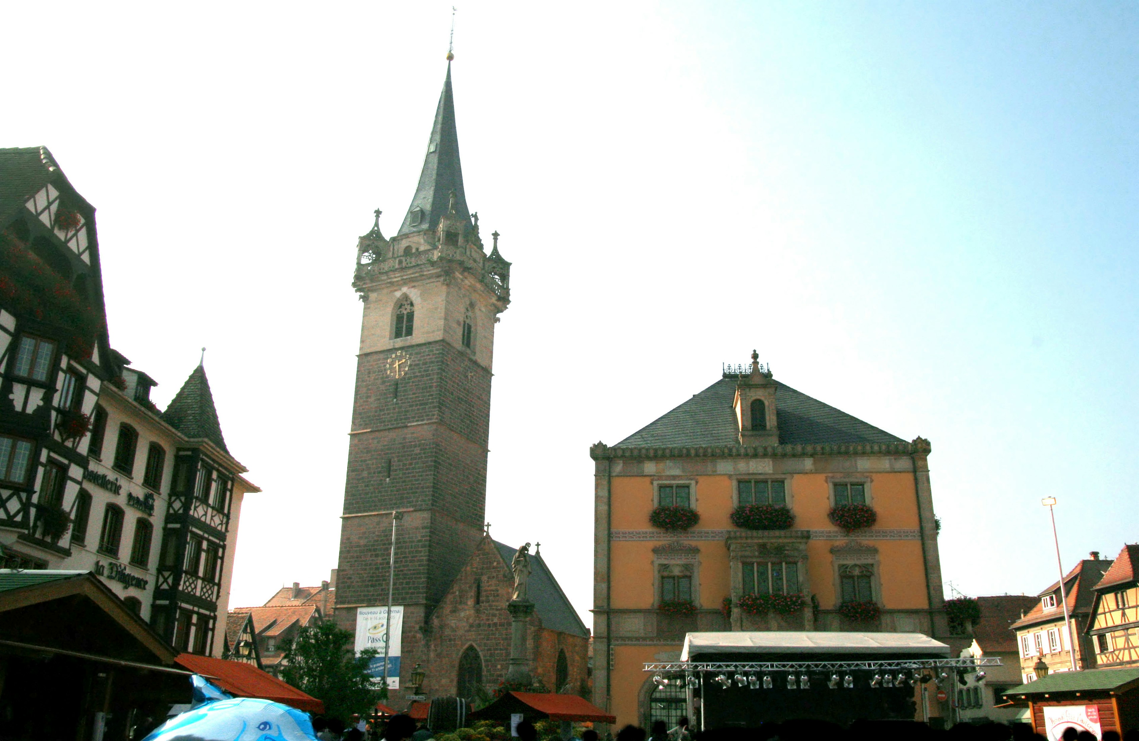 Historic tower and buildings in a vibrant town square