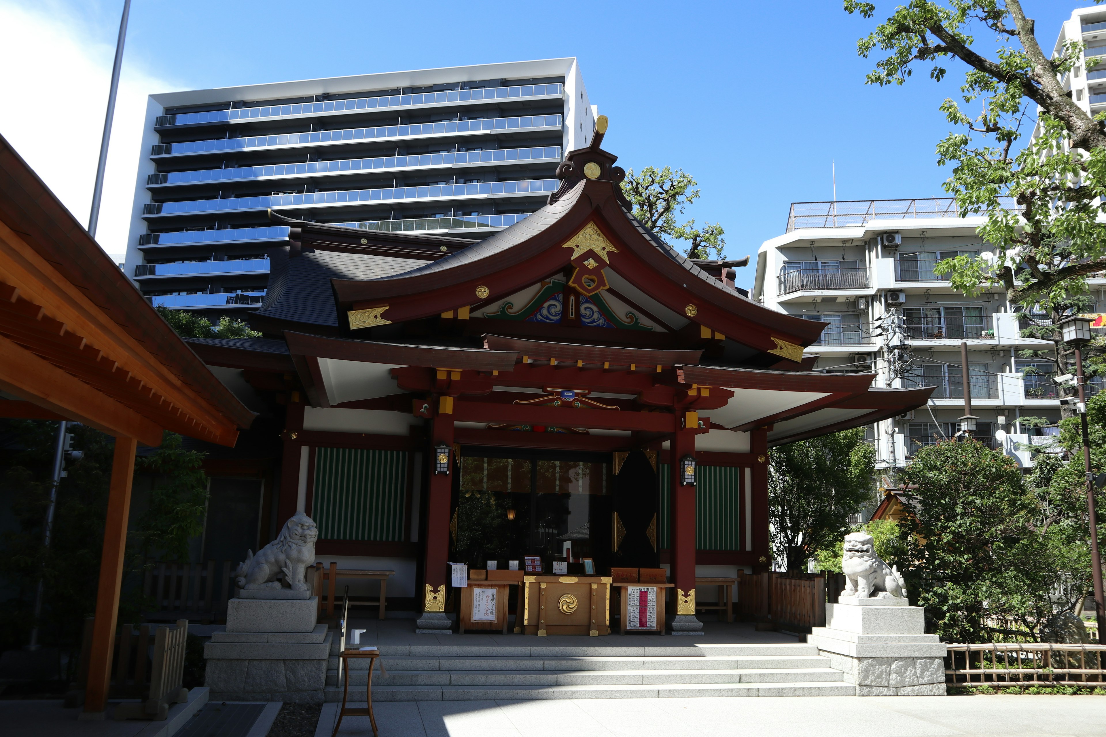 Exterior view of a shrine surrounded by modern buildings