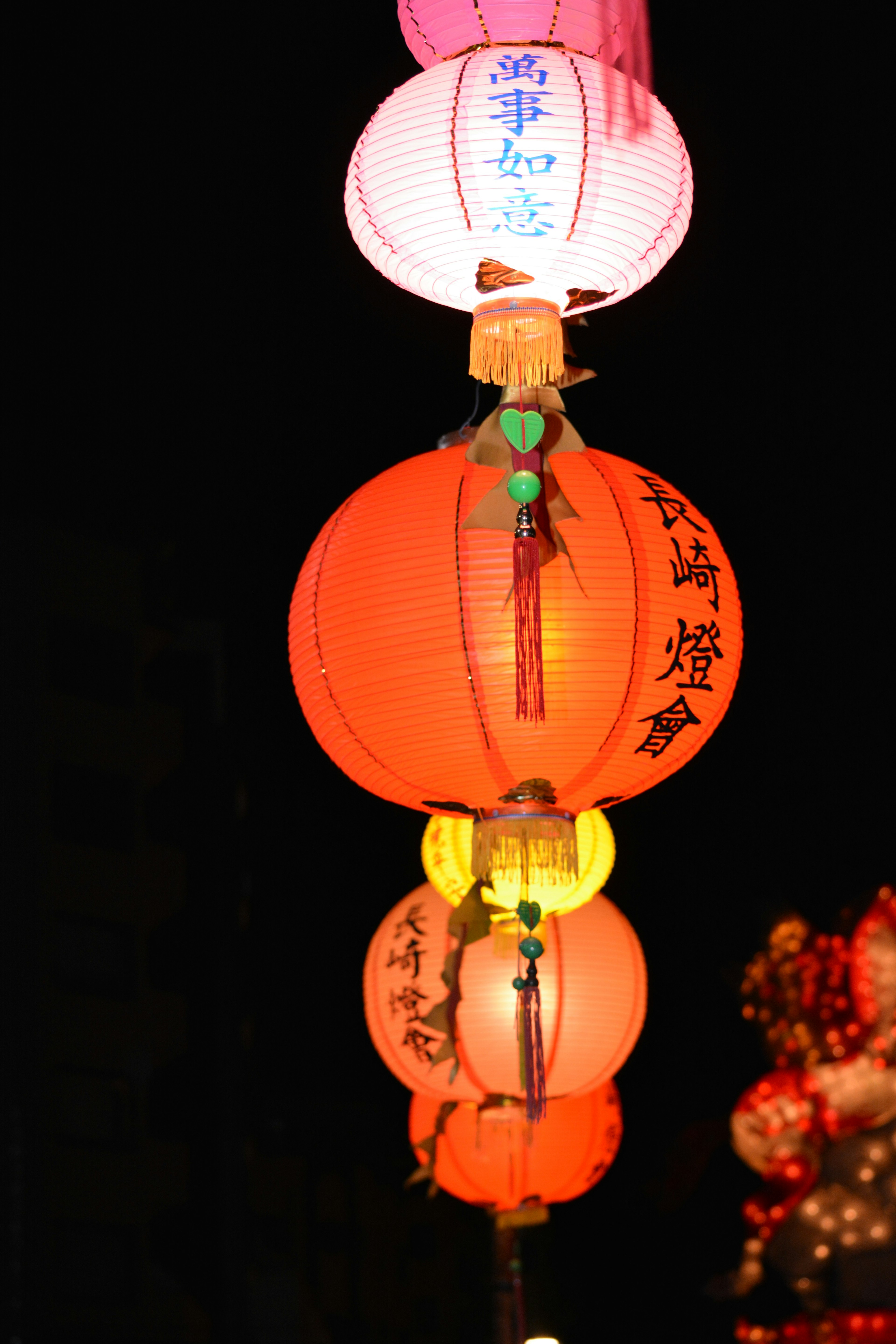 Colorful lanterns floating in the night sky