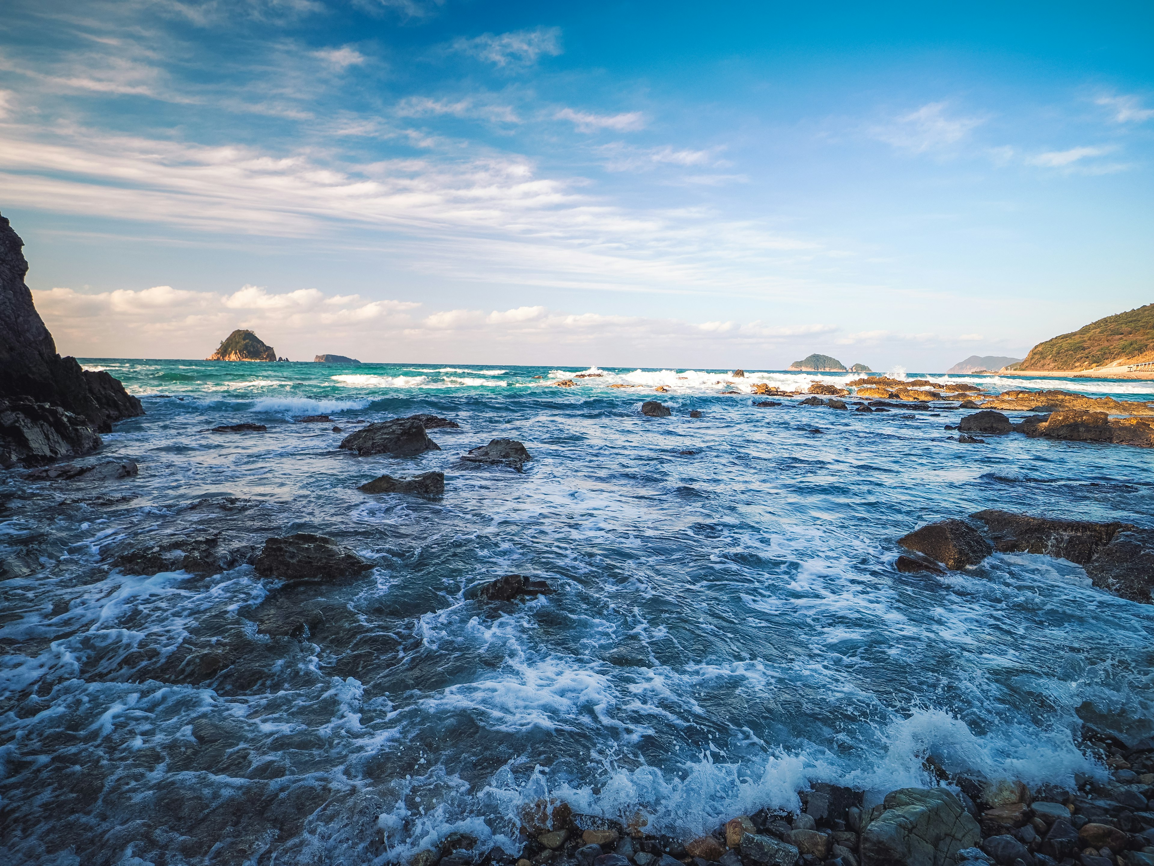 Coastal landscape with blue ocean and rocky shore