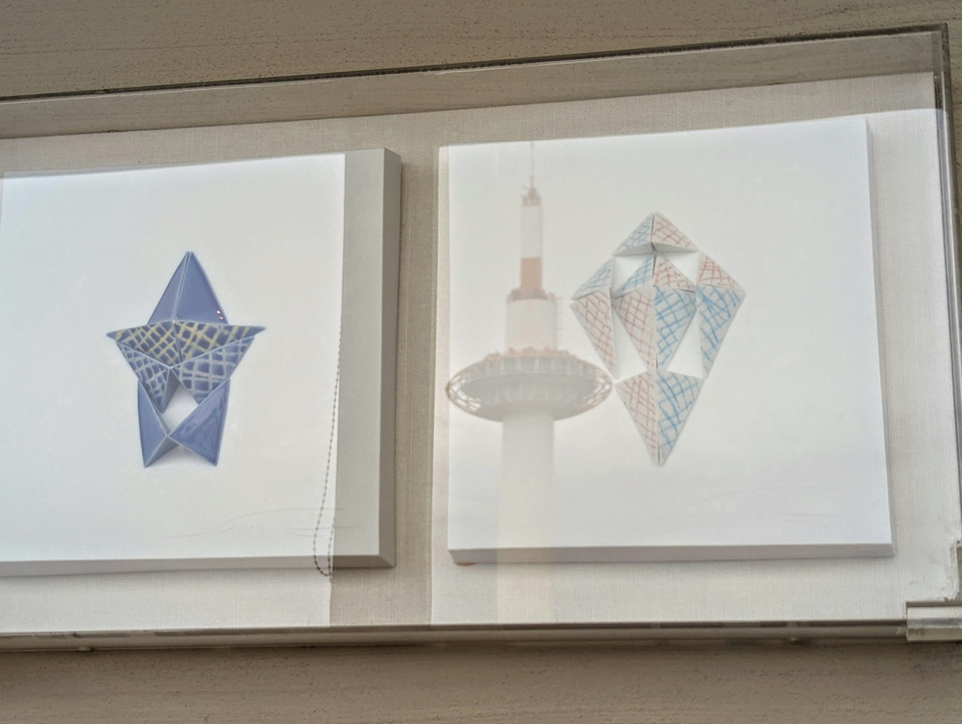 Blue star-shaped art and Kyoto Tower-inspired art displayed side by side