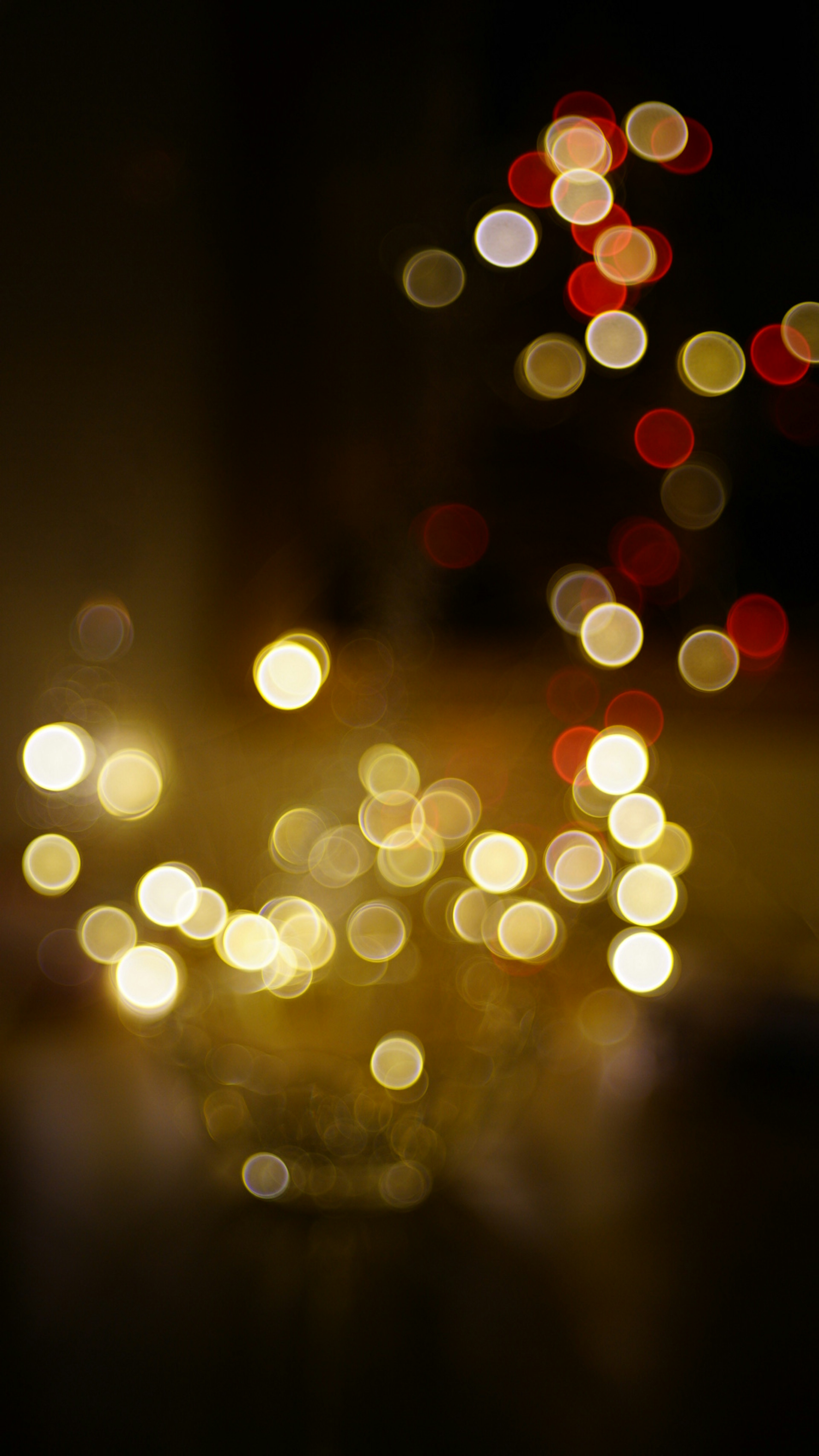 Blurred image of scattered warm light dots creating a cozy atmosphere