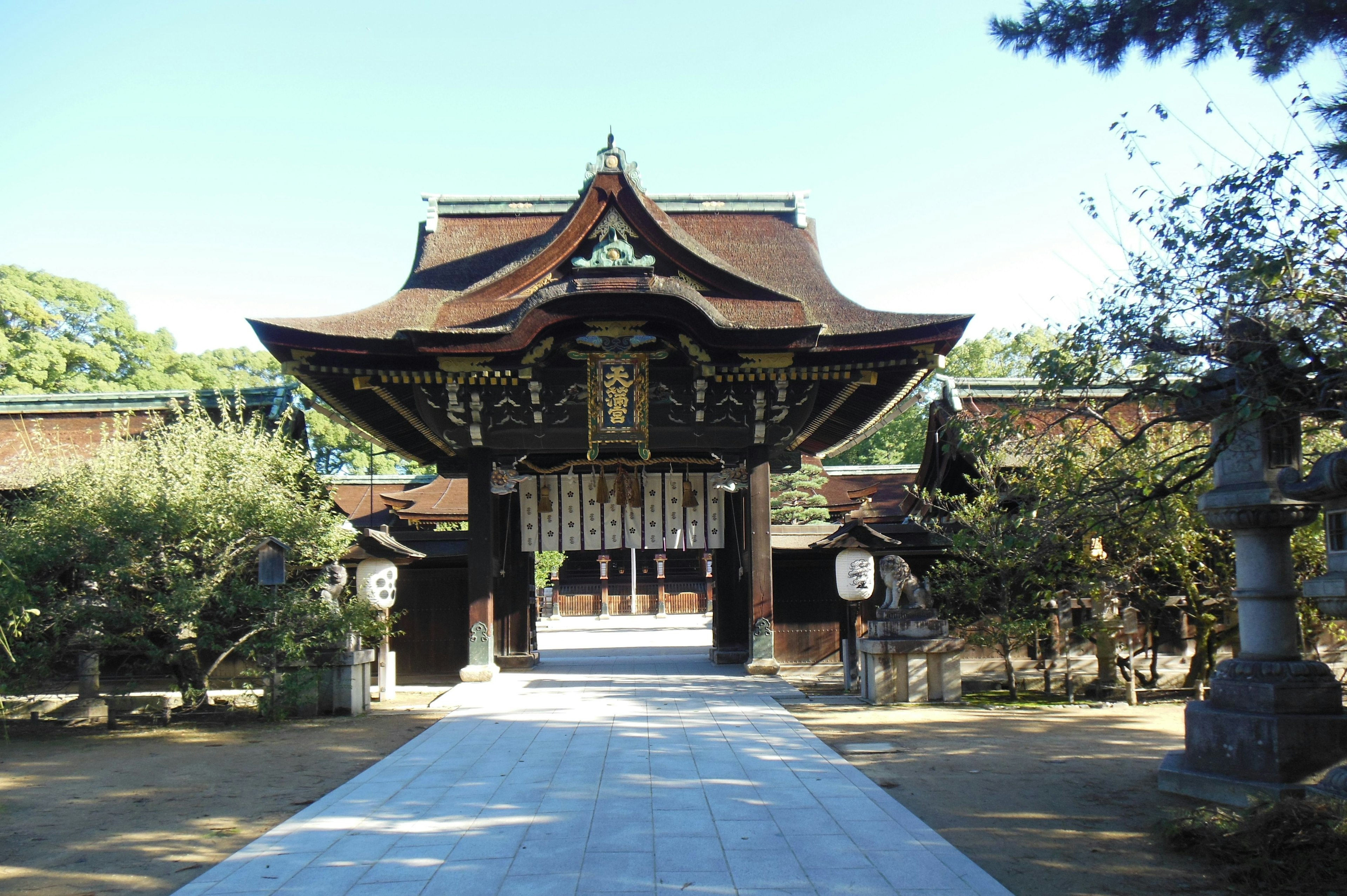 Traditional Japanese shrine gate surrounded by greenery