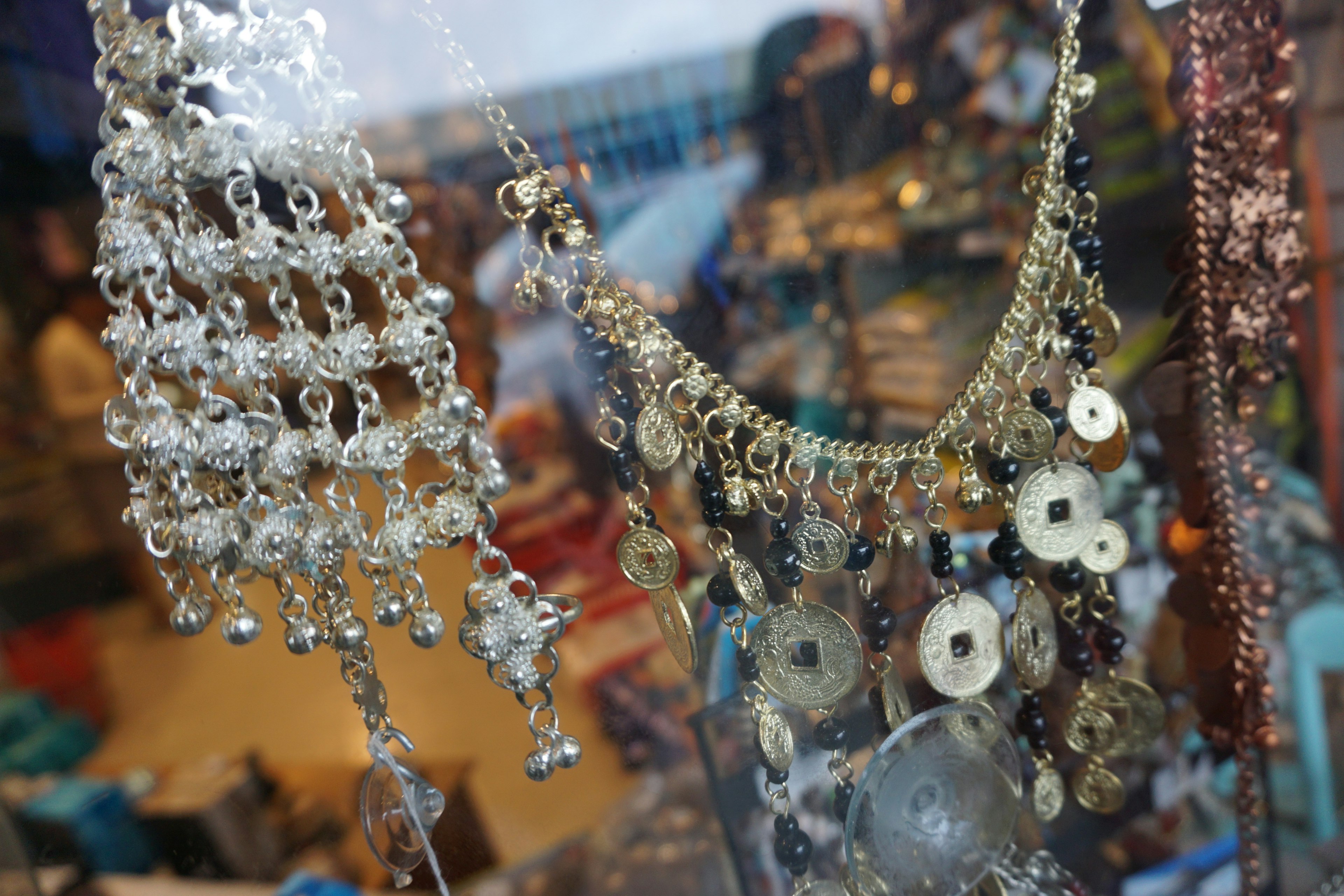 Close-up of decorative jewelry displayed in a showcase