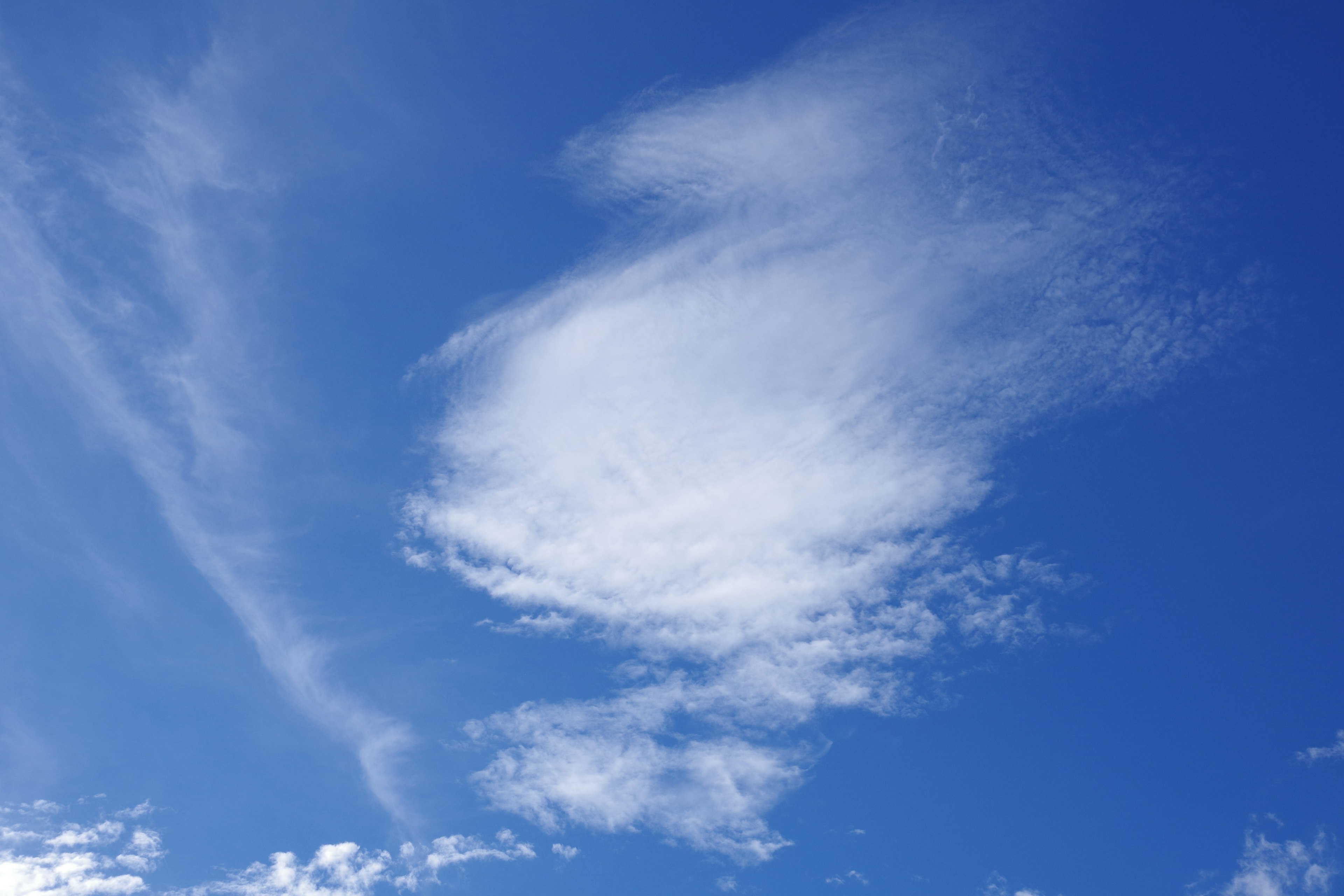 Unique shape of white clouds in a blue sky