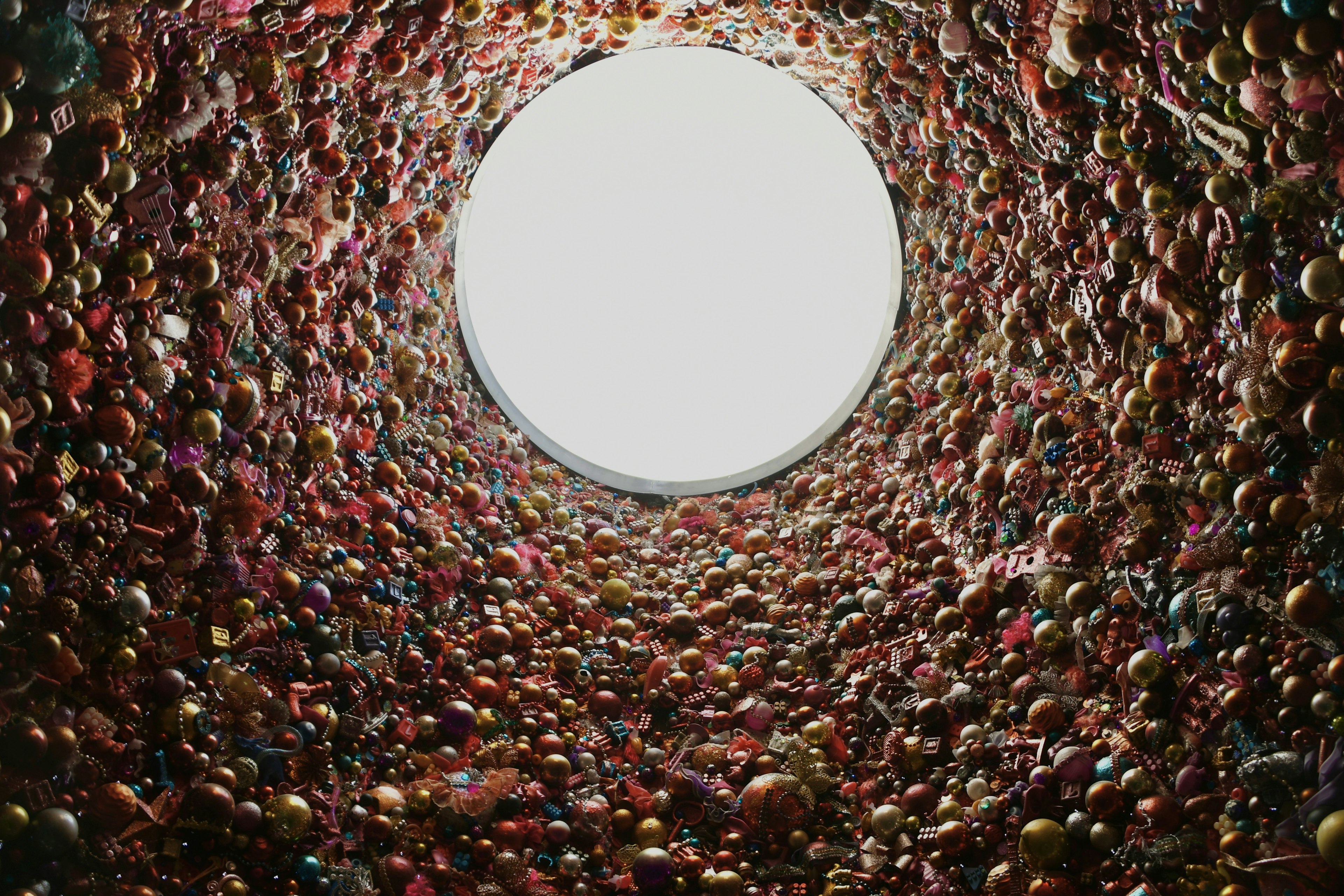 View of colorful wall from inside a circular opening