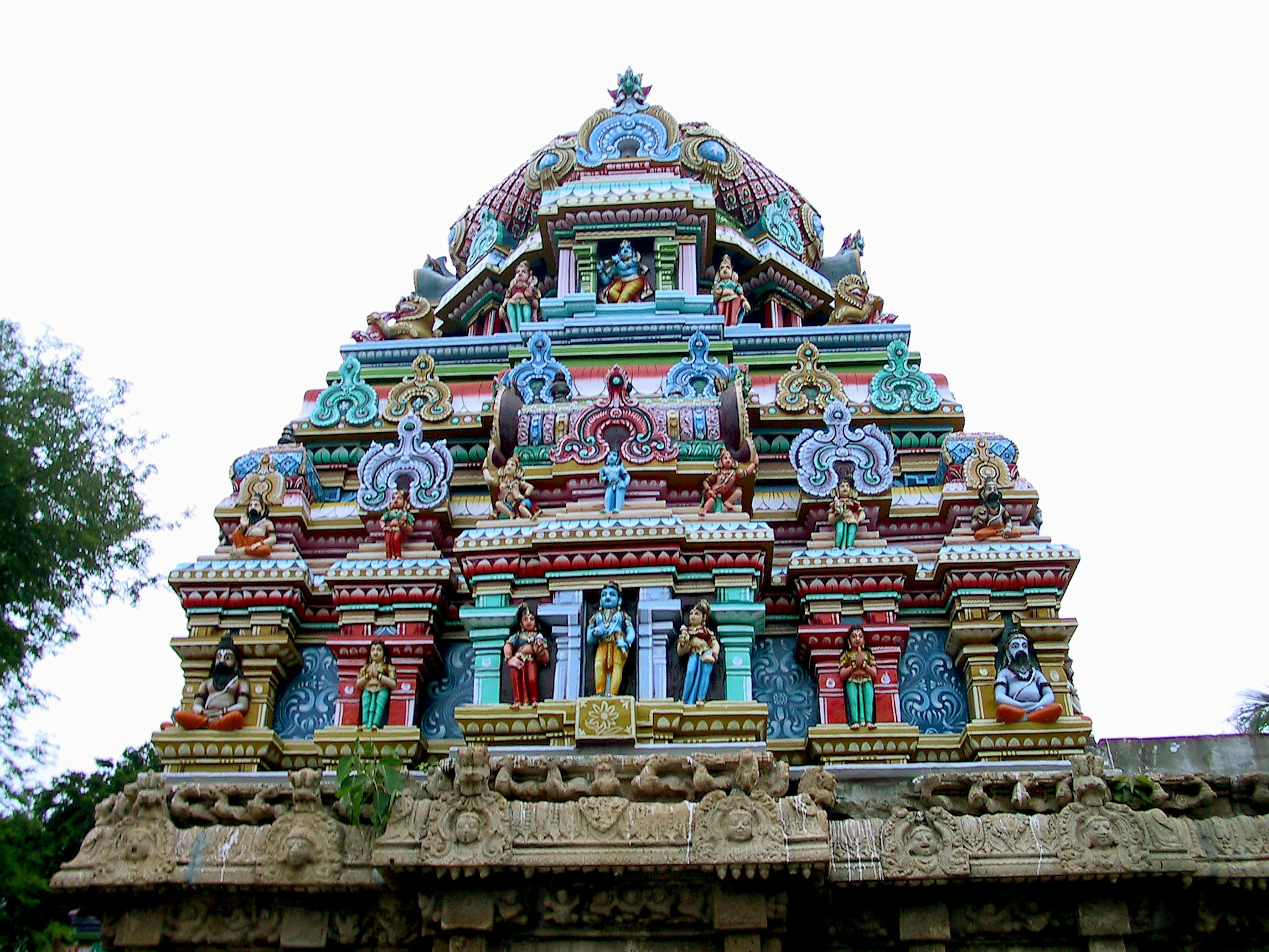 Image of a temple tower adorned with vibrant decorations